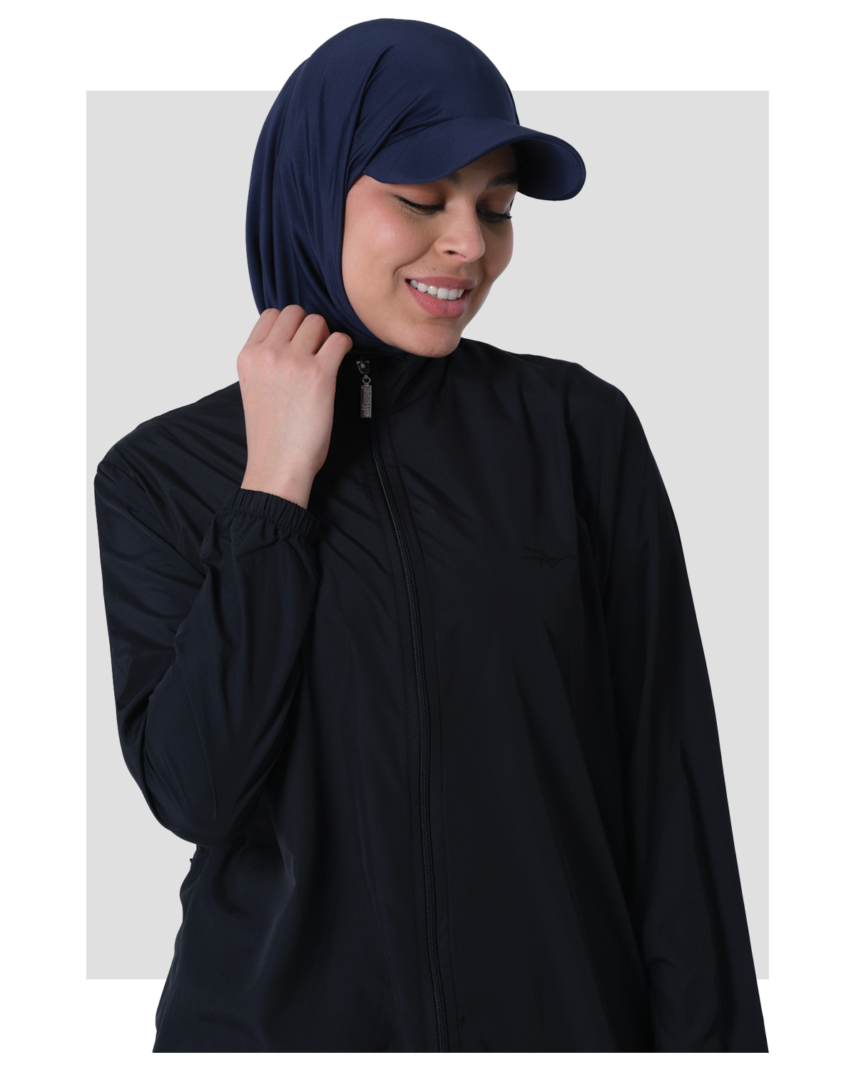 Woman wearing a NAVY SWIM HIJAB  with cap on a white background
