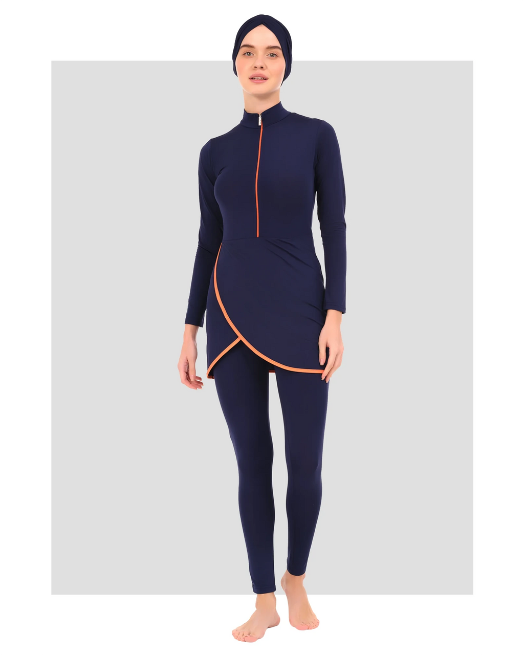 Navy burkini set front view with orange trim on white background.