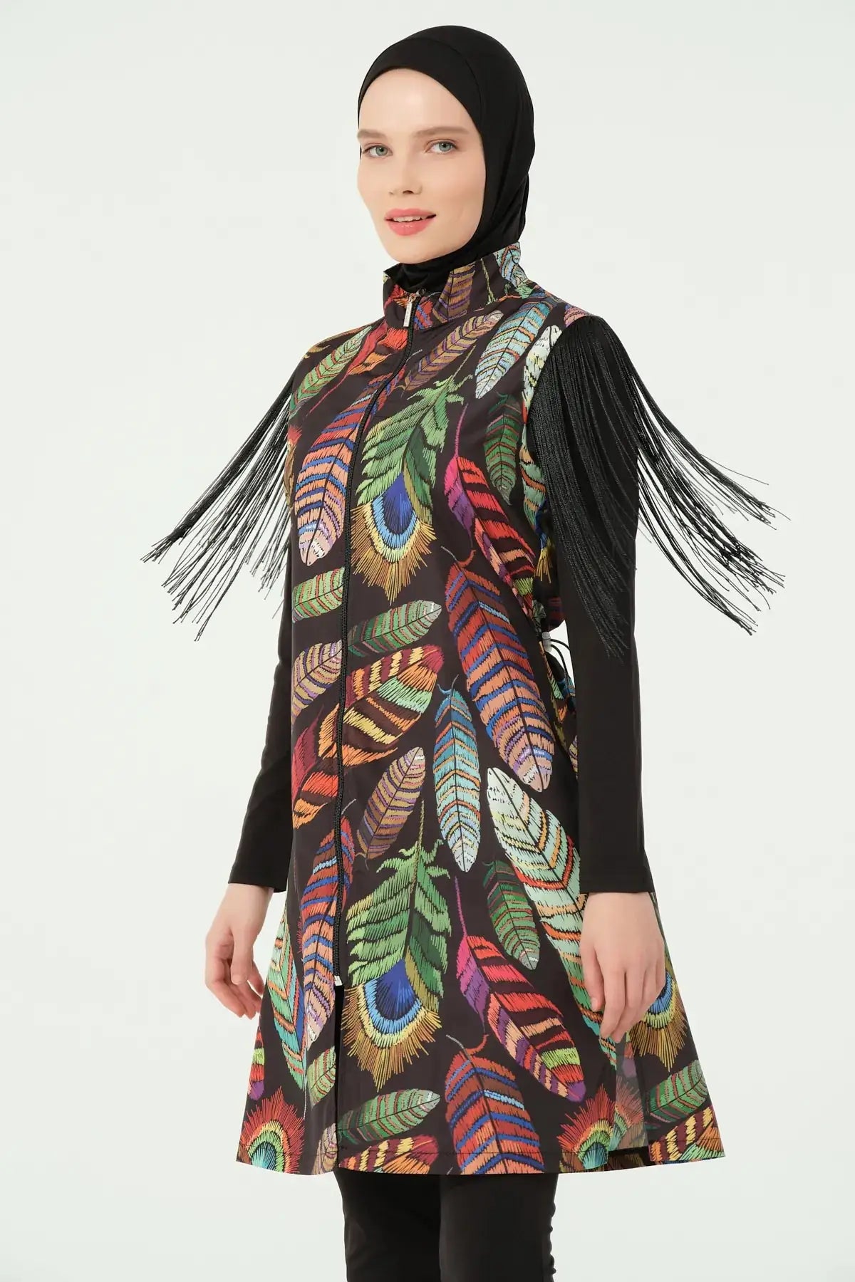 Close-up of bohemian feather-print burkini with fringe sleeves, front view.