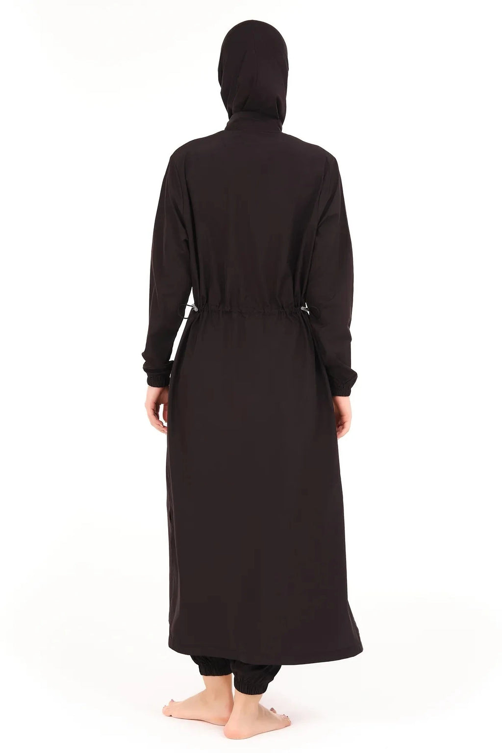 Back view of woman wearing black burkini with adjustable waist drawstring.