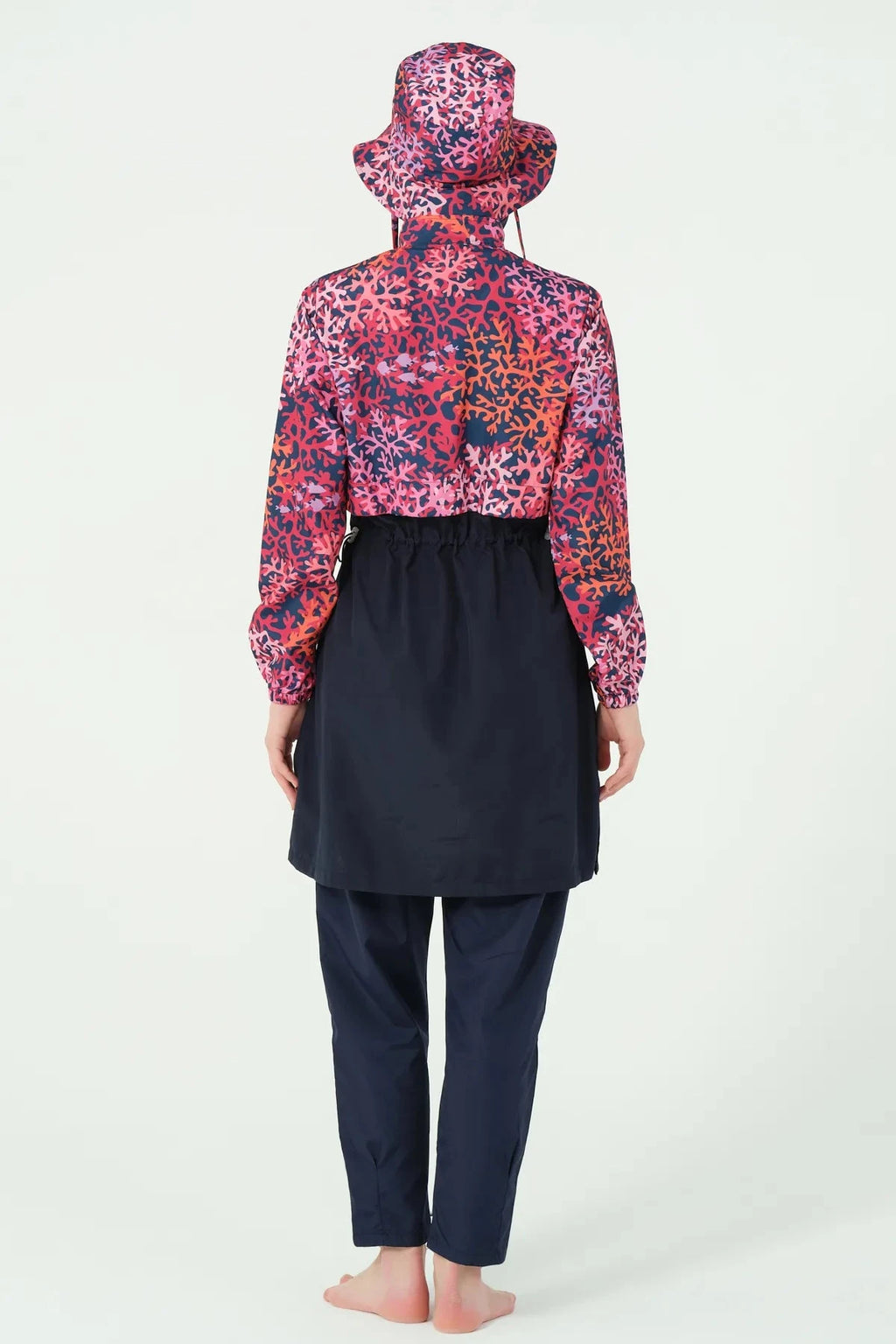 Navy and red coral print burkini set back view on model.