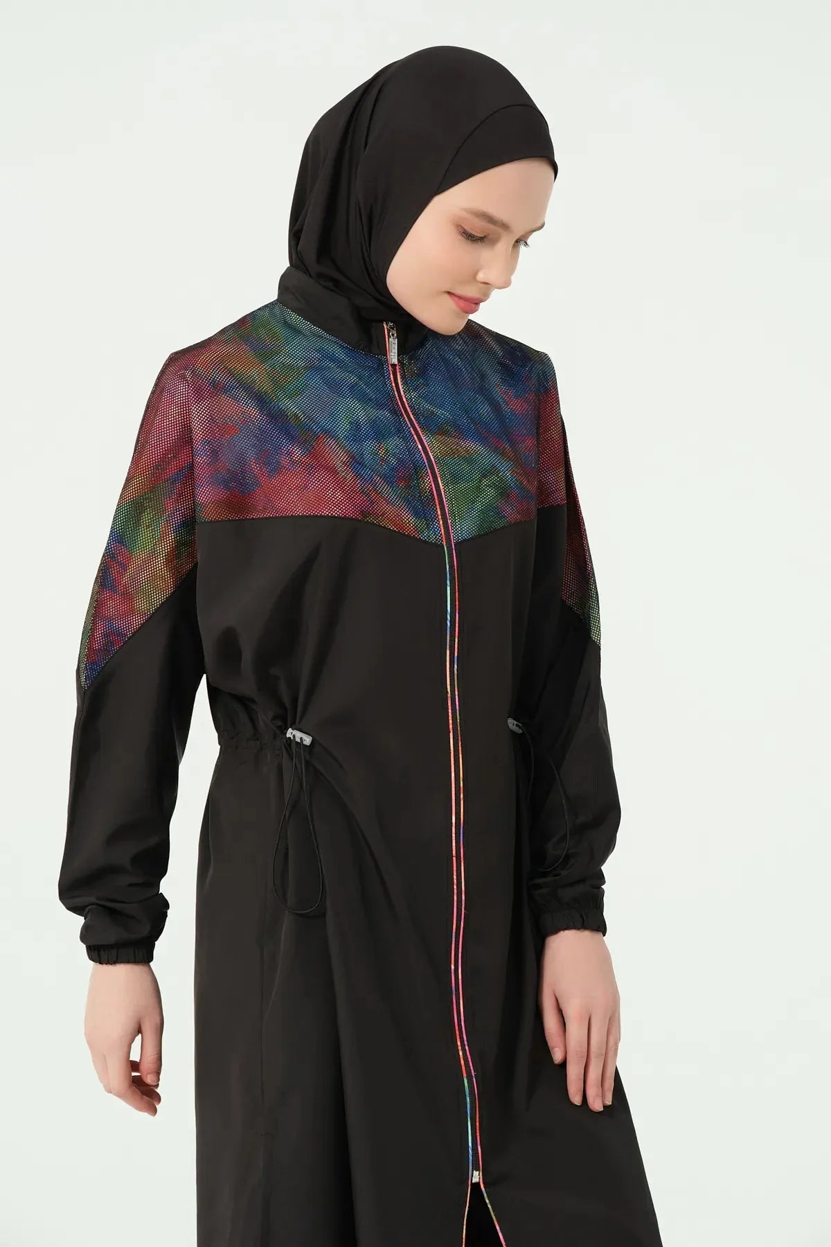 Side view close-up of black burkini set with iridescent shoulder detail.