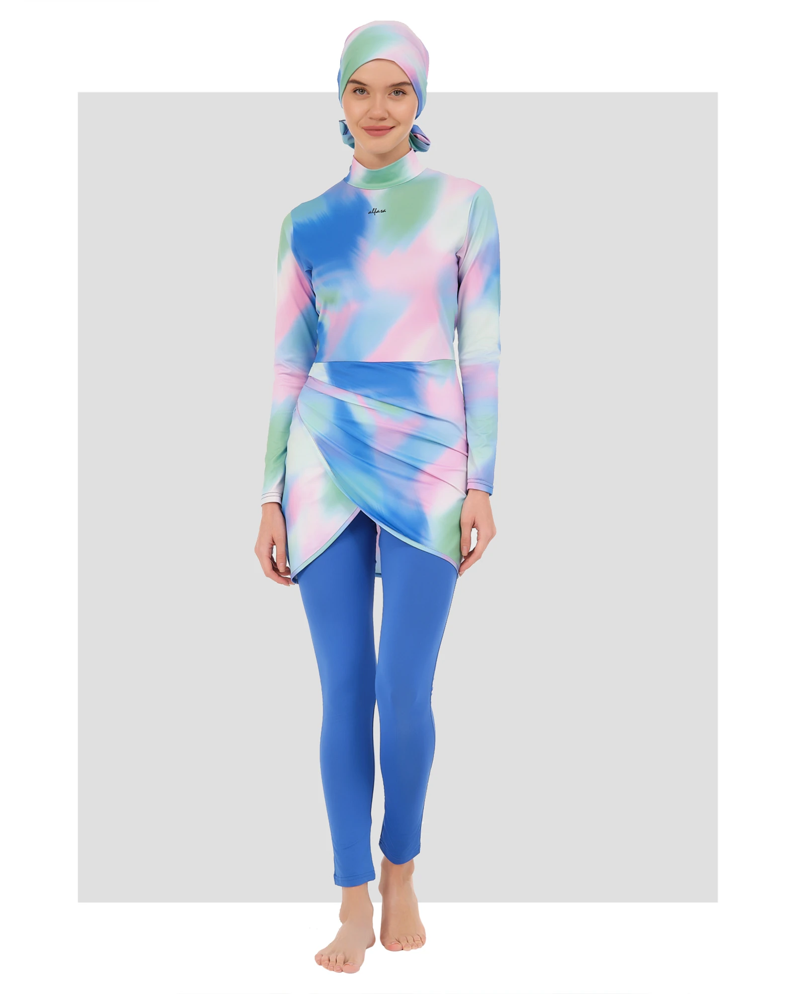 Model wearing pastel tie-dye burkini set front view on white background.