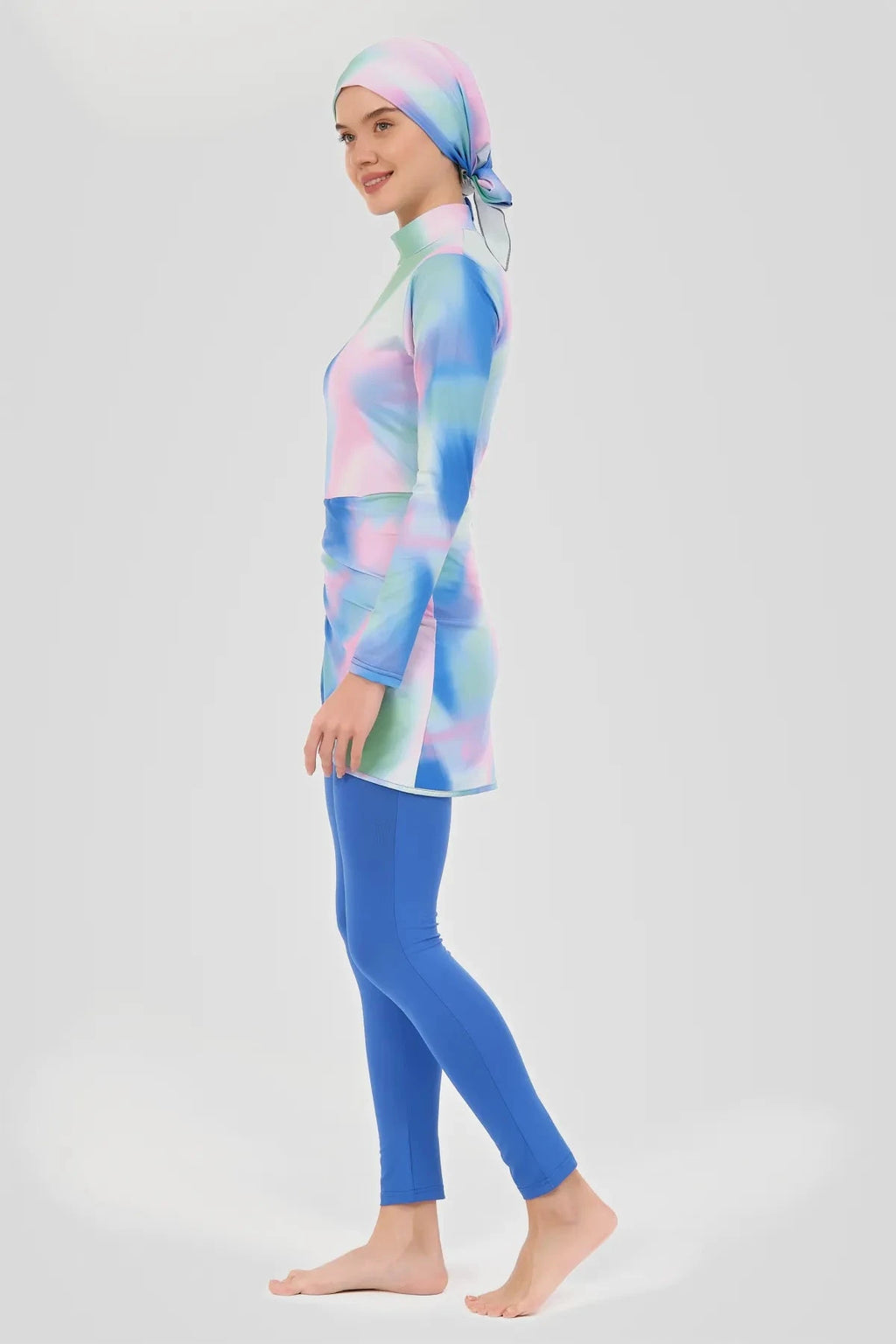 Modest burkini set in pastel tie-dye colors, side view pose.