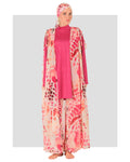 Model in fuchsia burkini with patterned chiffon kimono and matching headscarf.