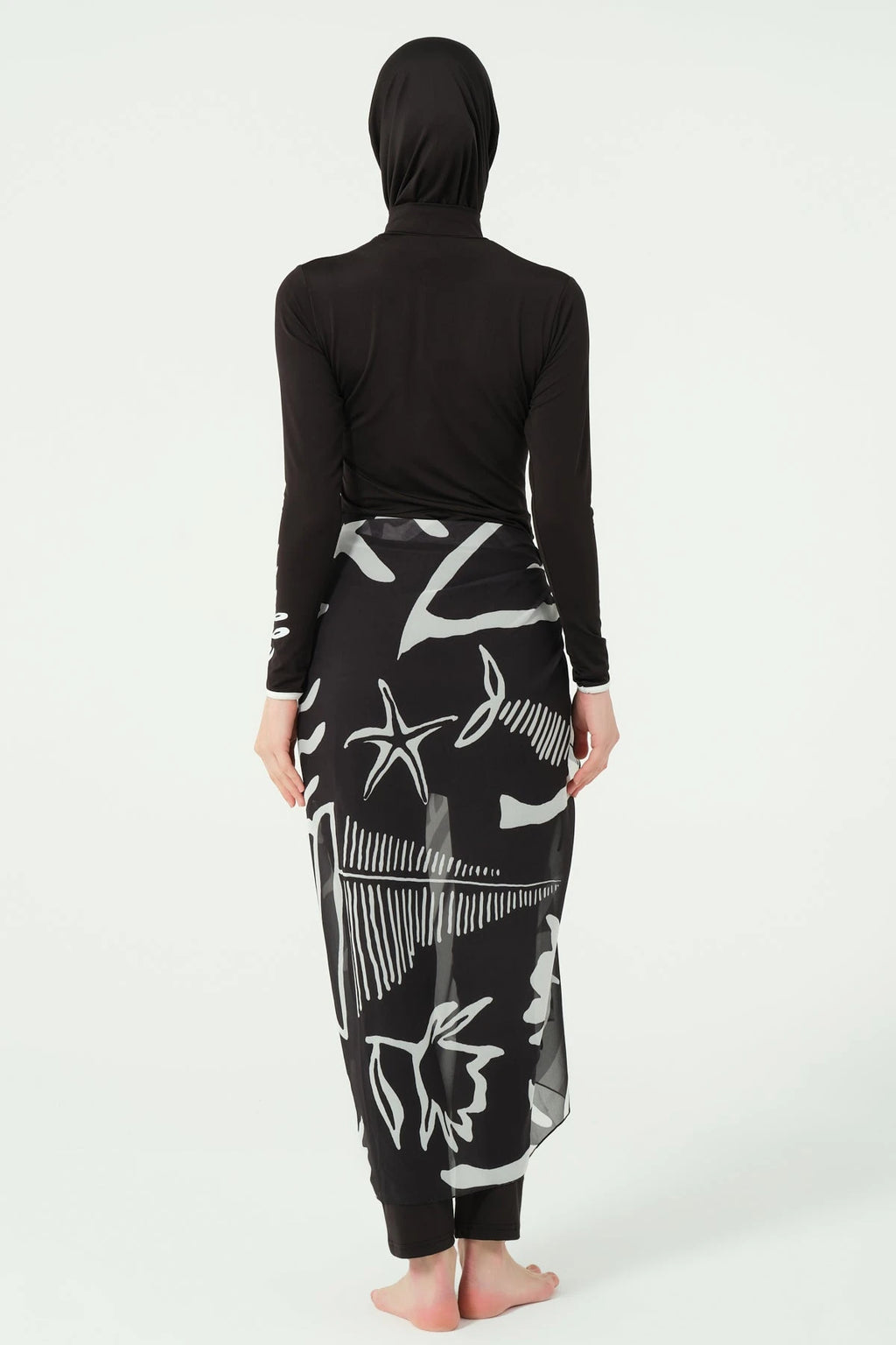 Black burkini set with printed sarong, back view on white background