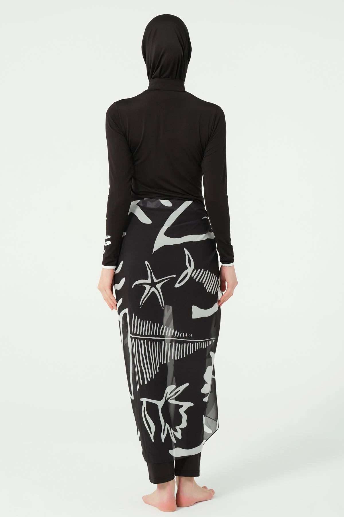 Black burkini set with printed sarong, back view on white background