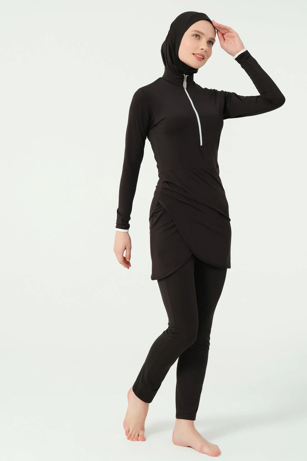 Black burkini set without sarong, side pose showing movement
