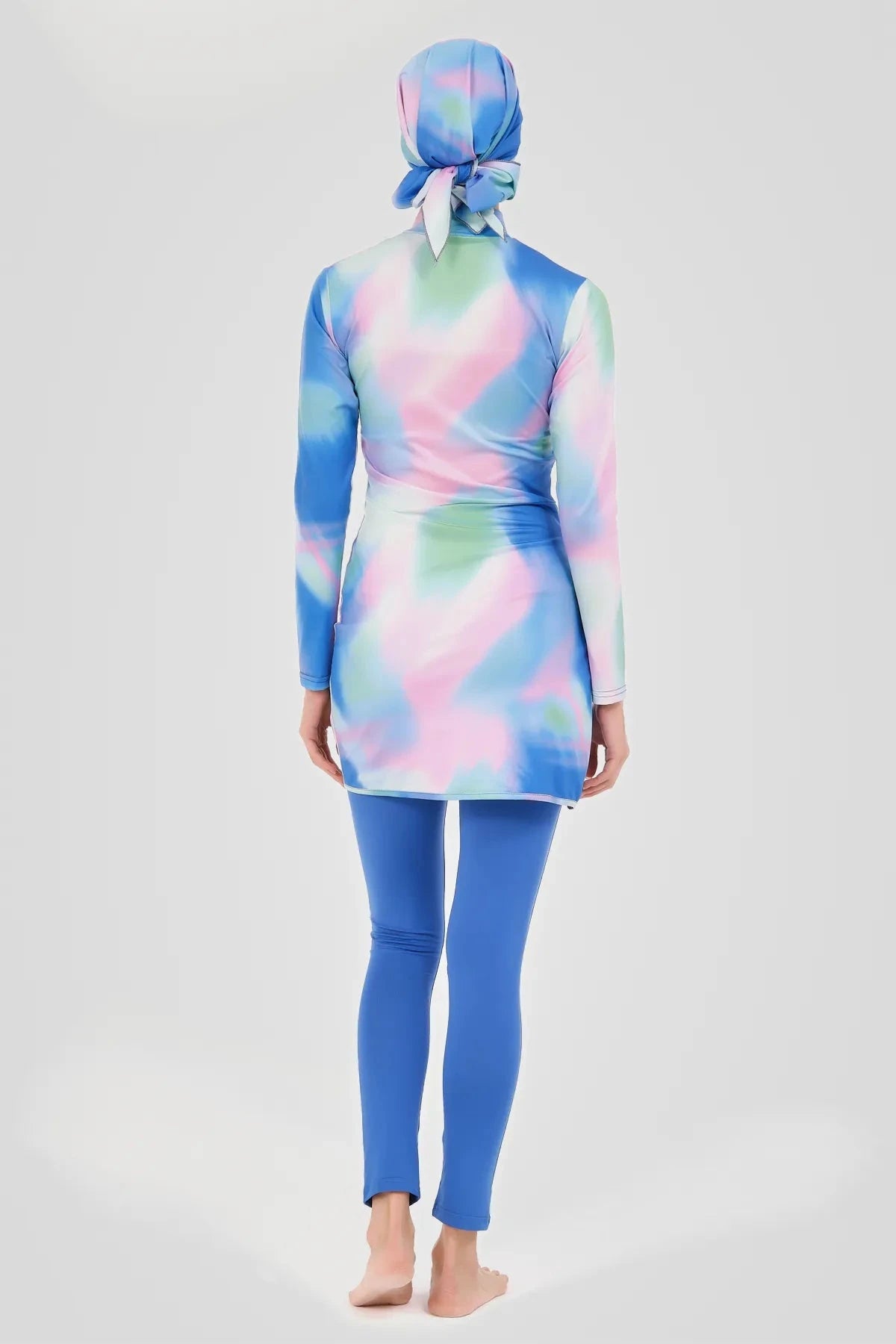 Full coverage tie-dye burkini set with blue swim pants, back view.