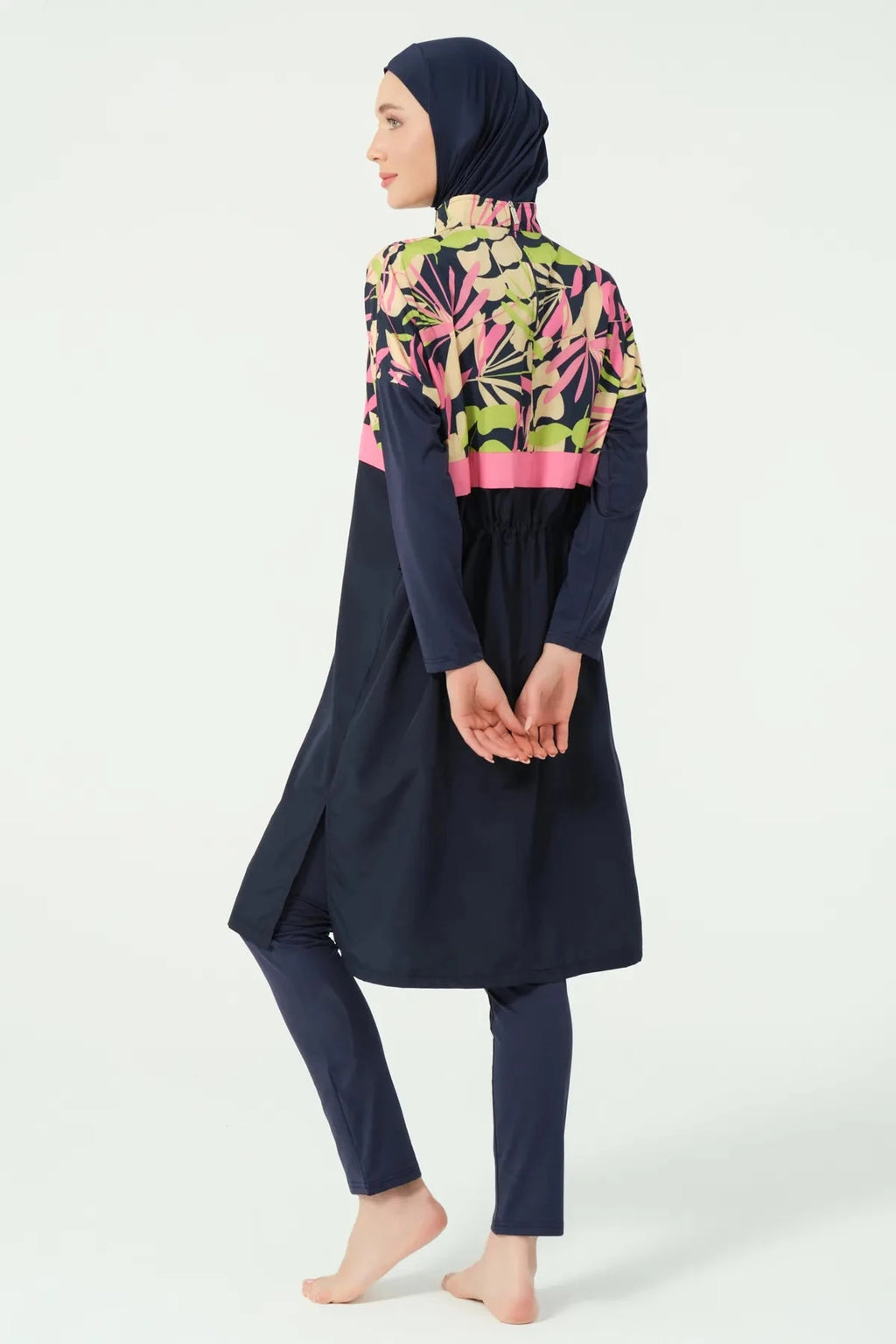 Back side view of tropical print burkini tunic with side slits.
