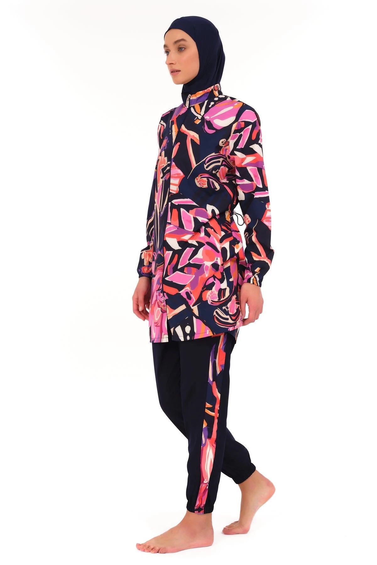 Side view of navy abstract print burkini set on white background.