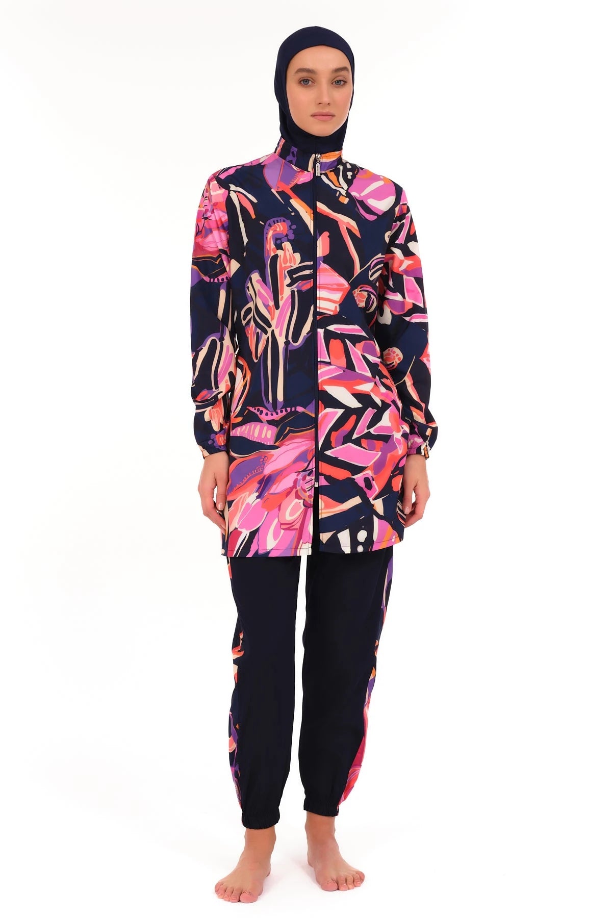 Full view of navy abstract print burkini set on white background.