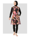 Woman in black abstract print burkini set, front view, full coverage.