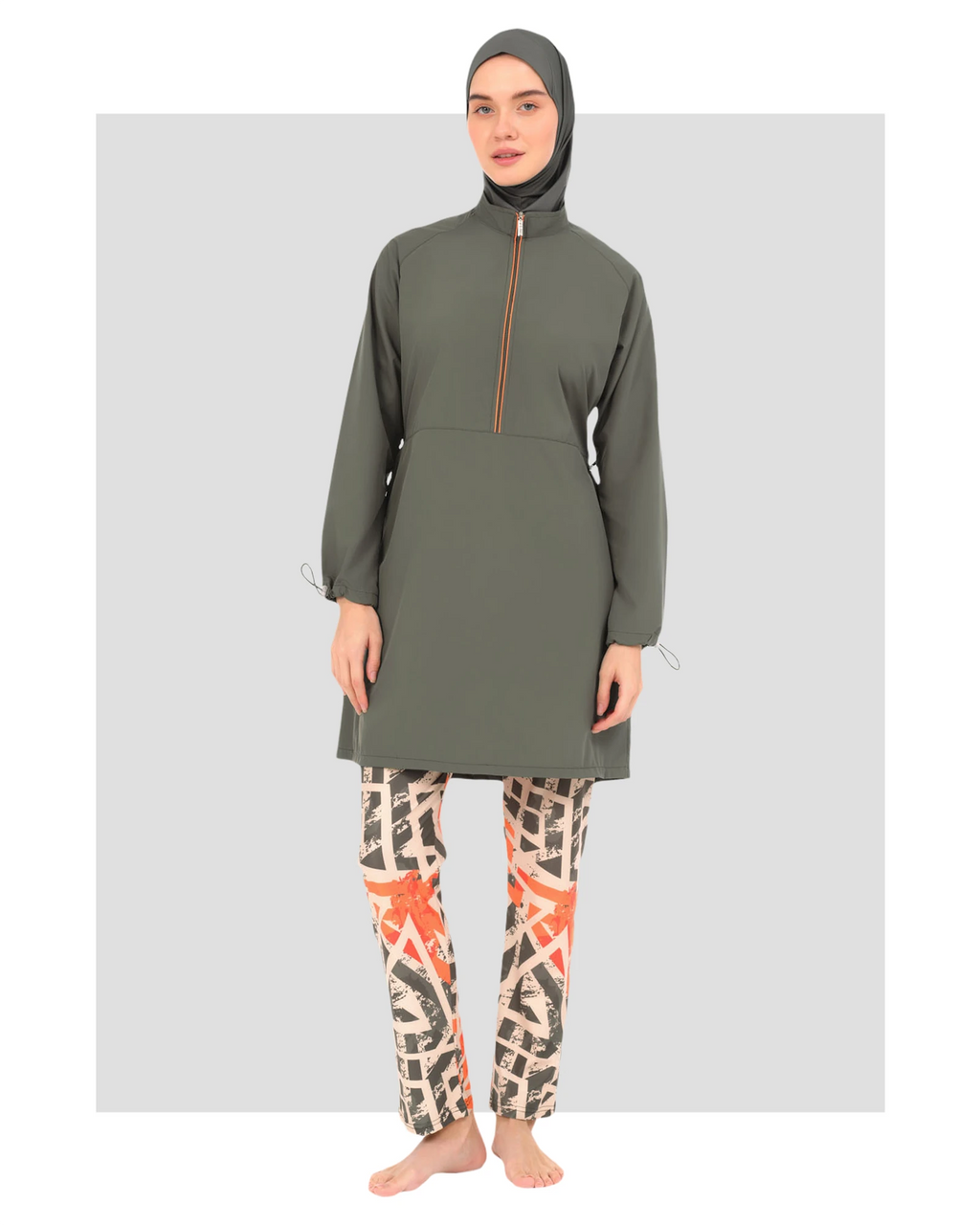 Woman in modern burkini with geometric print pants, front view.