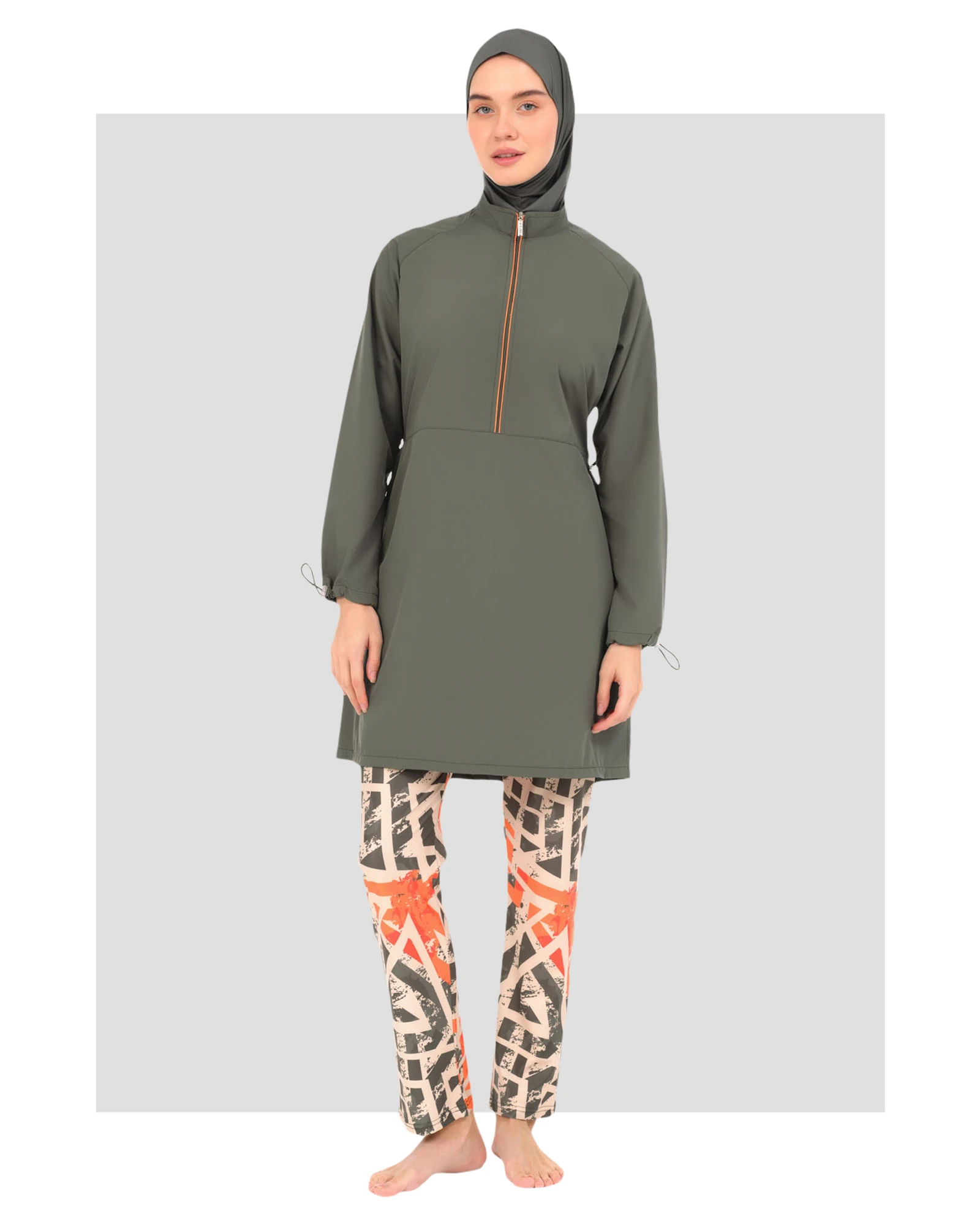 Woman in modern burkini with geometric print pants, front view.