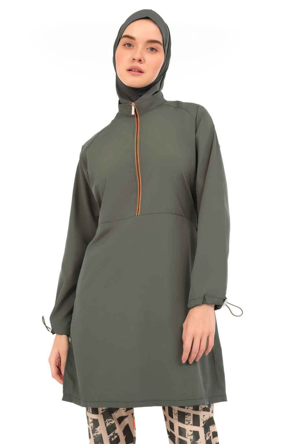Upper view of woman in modern burkini with geometric pants.