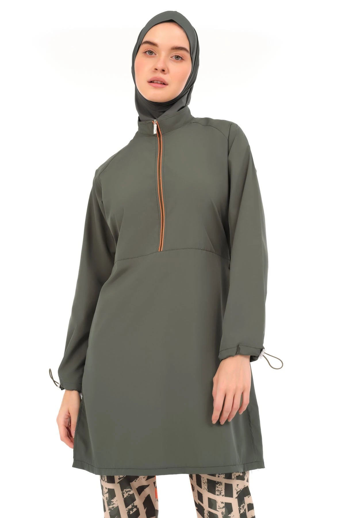 Upper view of woman in modern burkini with geometric pants.