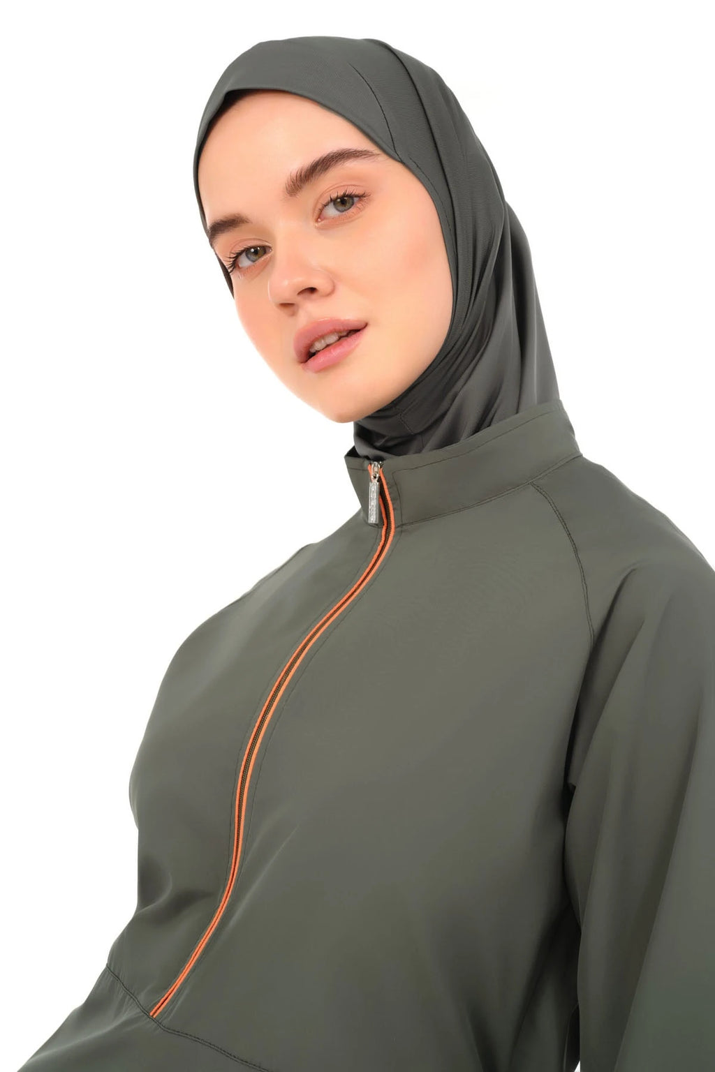 Close-up of burkini hijab and top with orange zipper detail.