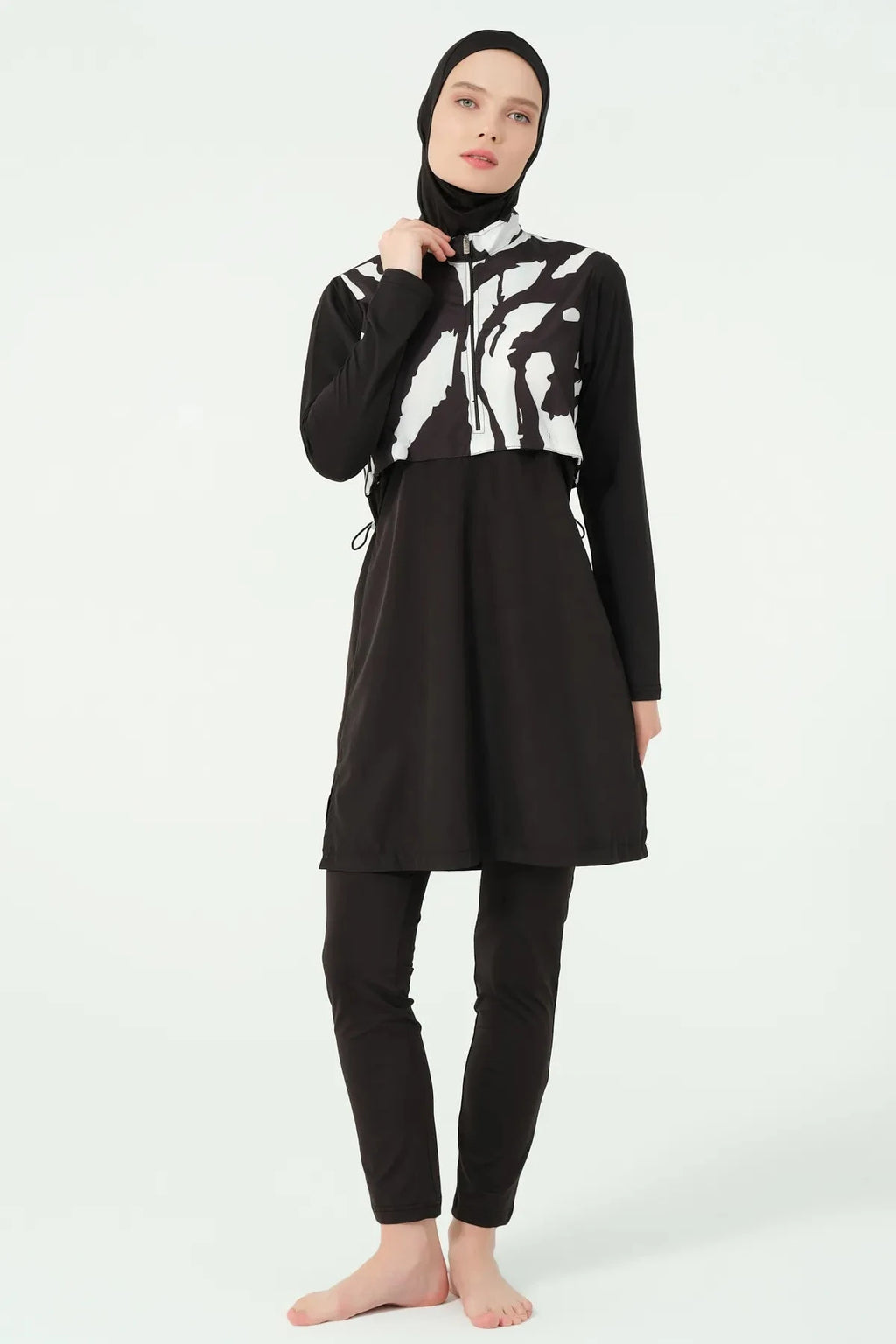 Black and white burkini set with half-zip detail on model