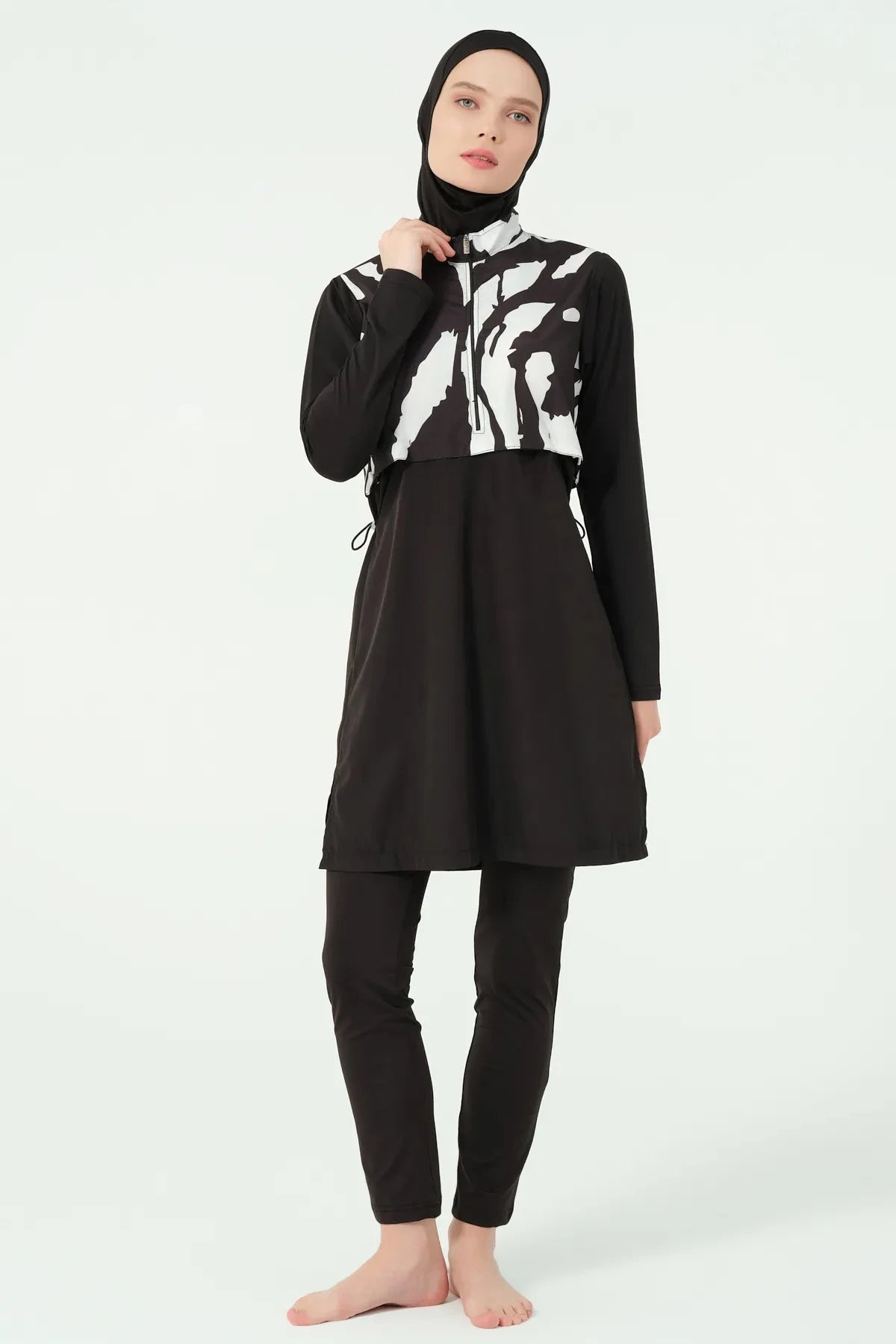 Black and white burkini set with half-zip detail on model