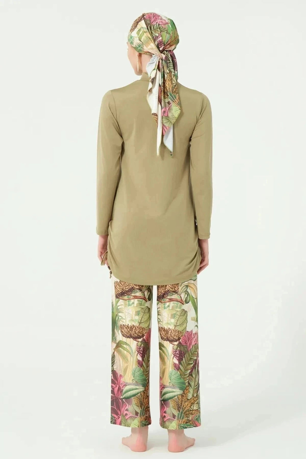 Khaki burkini with botanical print pants and matching head covering, back view.
