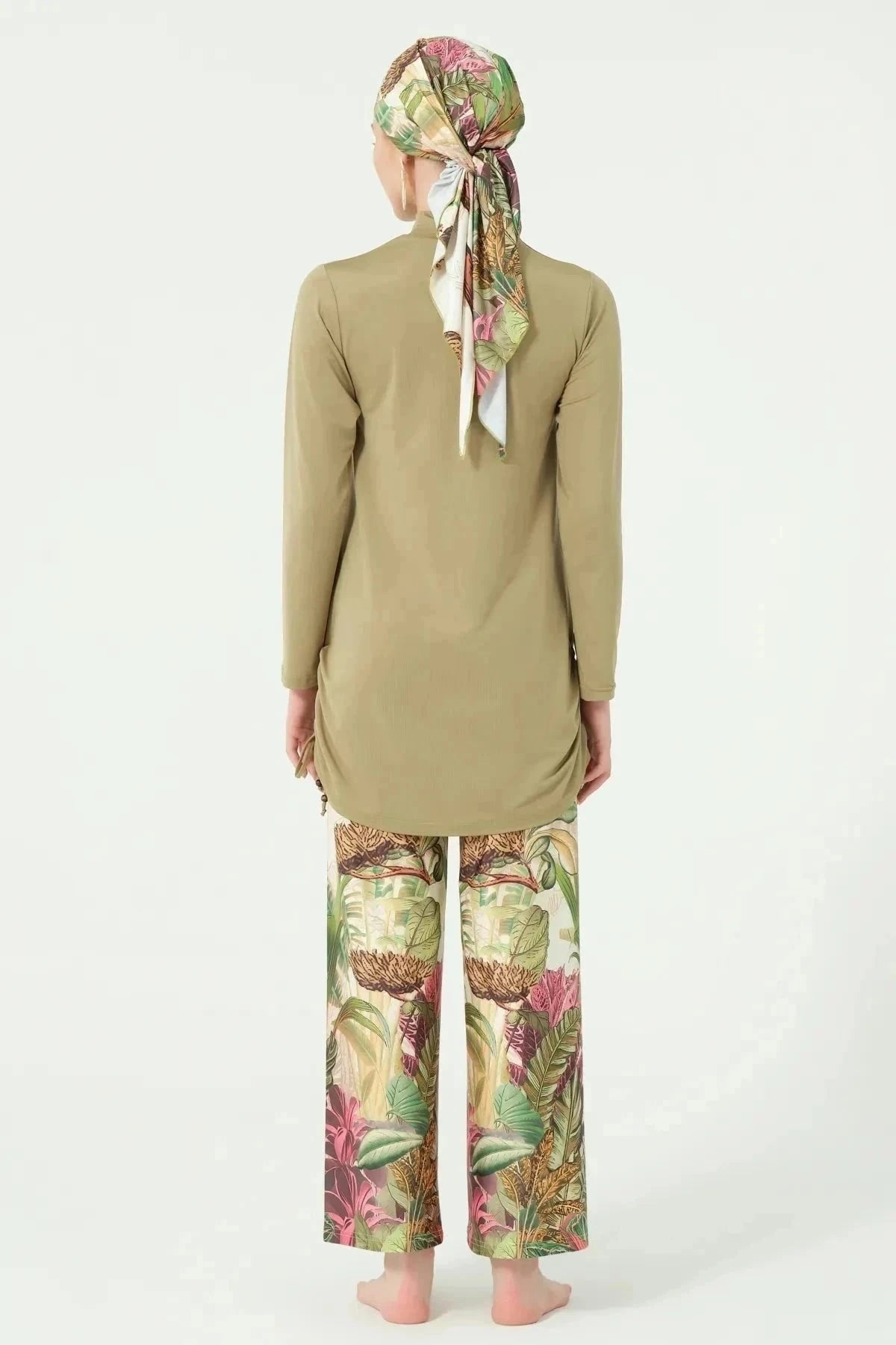 Khaki burkini with botanical print pants and matching head covering, back view.