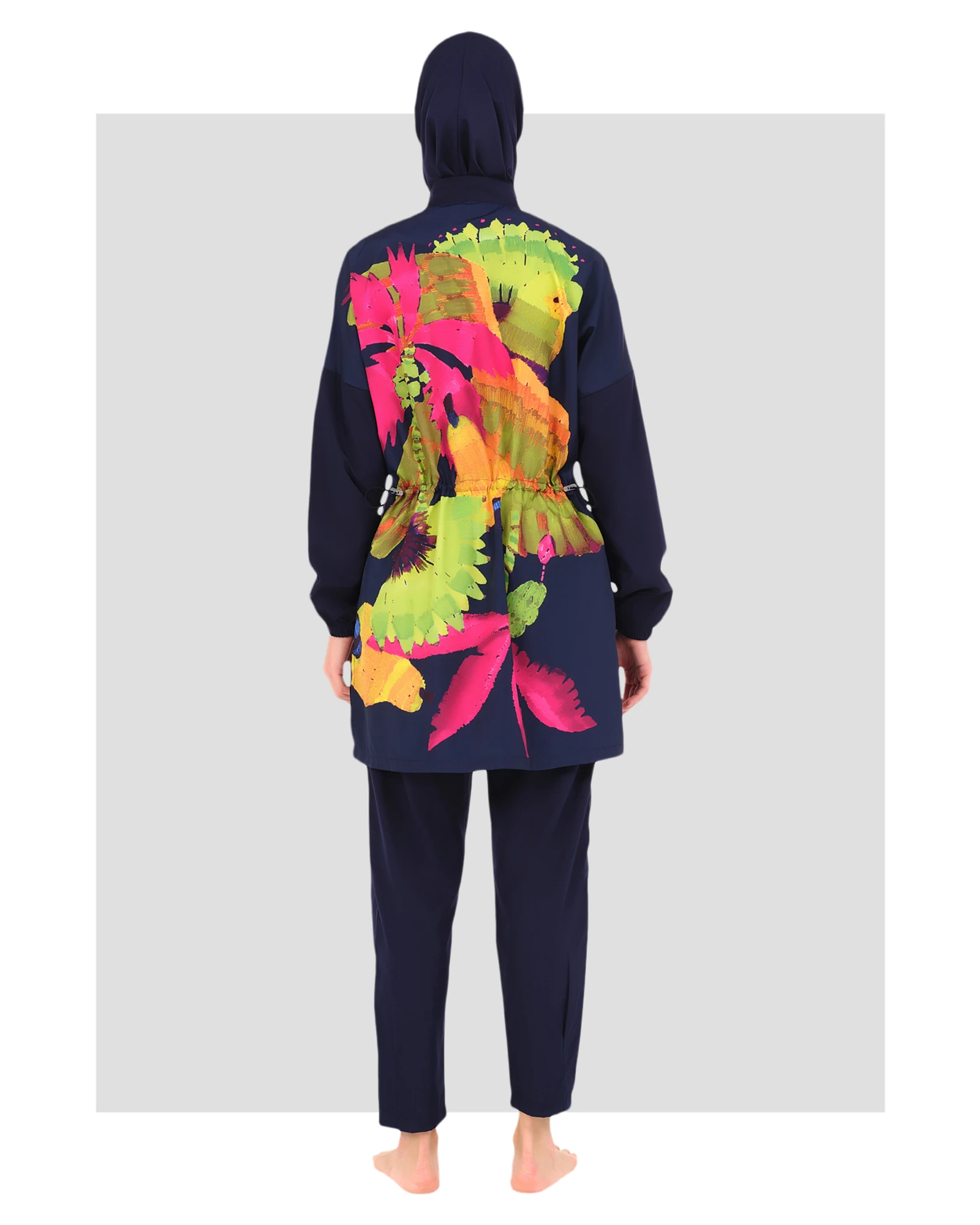 Navy burkini with vibrant floral back design and adjustable waist tie.