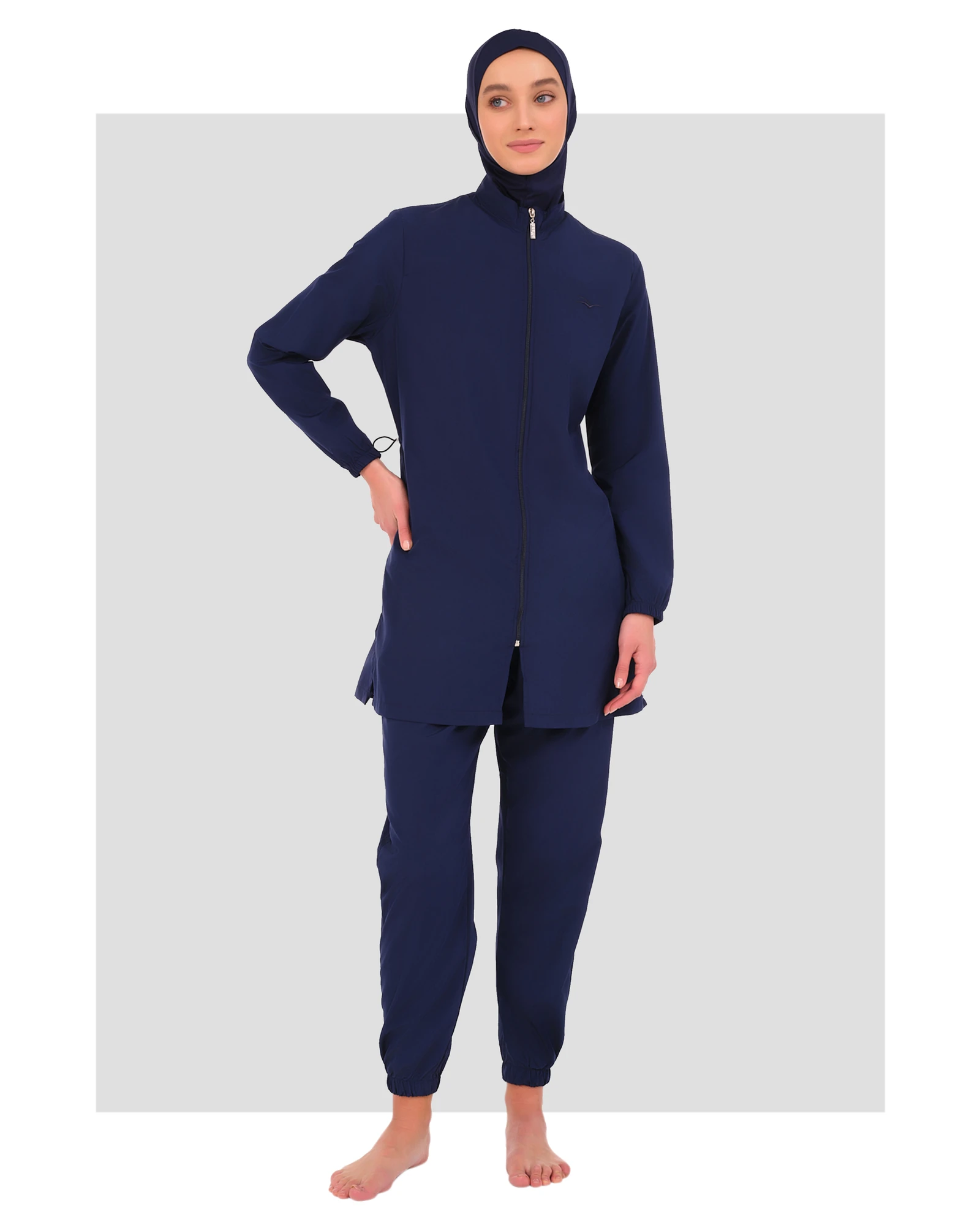 Navy blue burkini set with zipper tunic and jogger pants, front view.