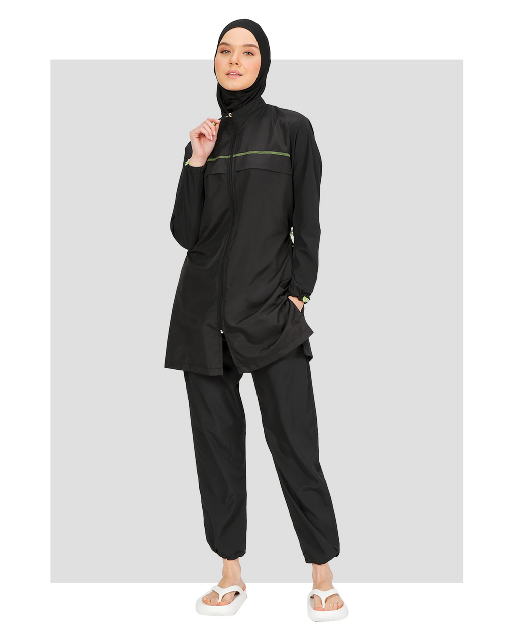 Black burkini set with neon accents, hijab, and jogger pants, front view.