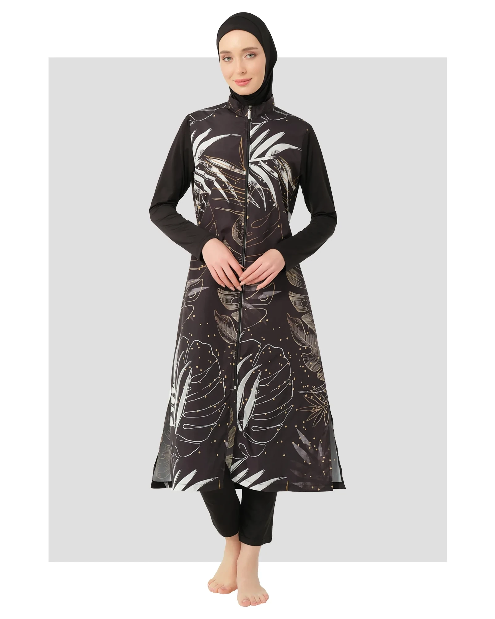Black burkini with gold and white leaf print, front view.
