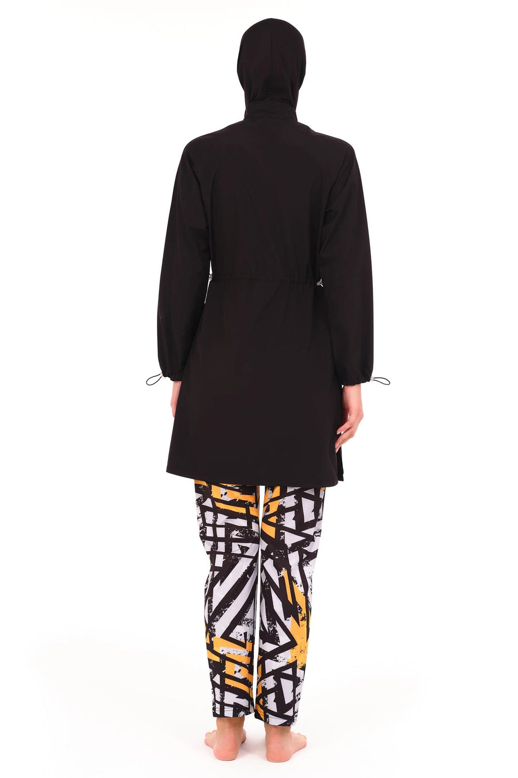 Back view of black burkini top and geometric print swim pants.