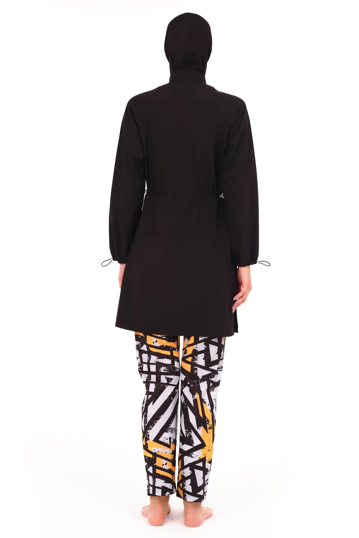 Back view of black burkini top and geometric print swim pants.