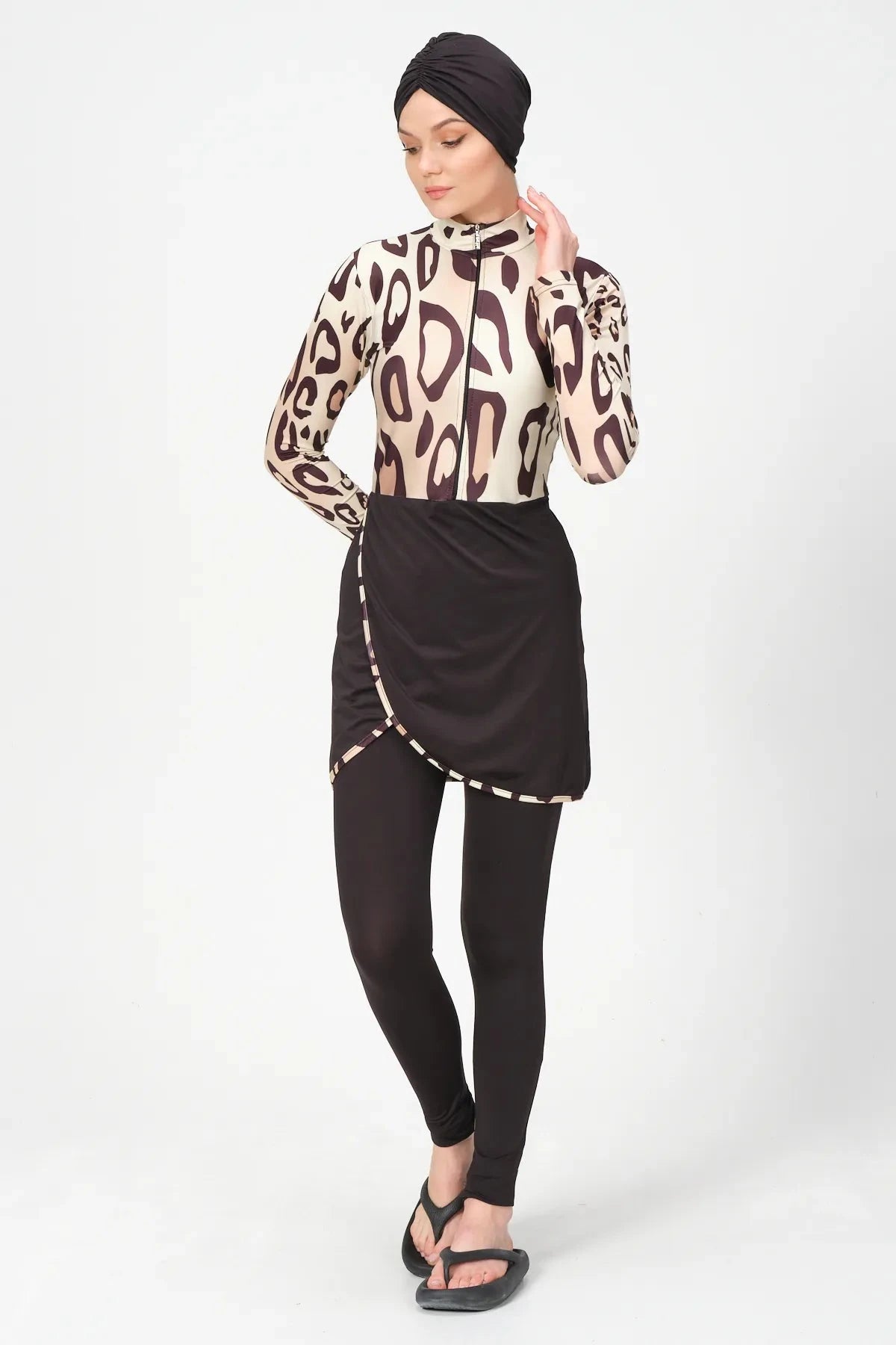 Full coverage leopard print burkini swimsuit on model, front pose.
