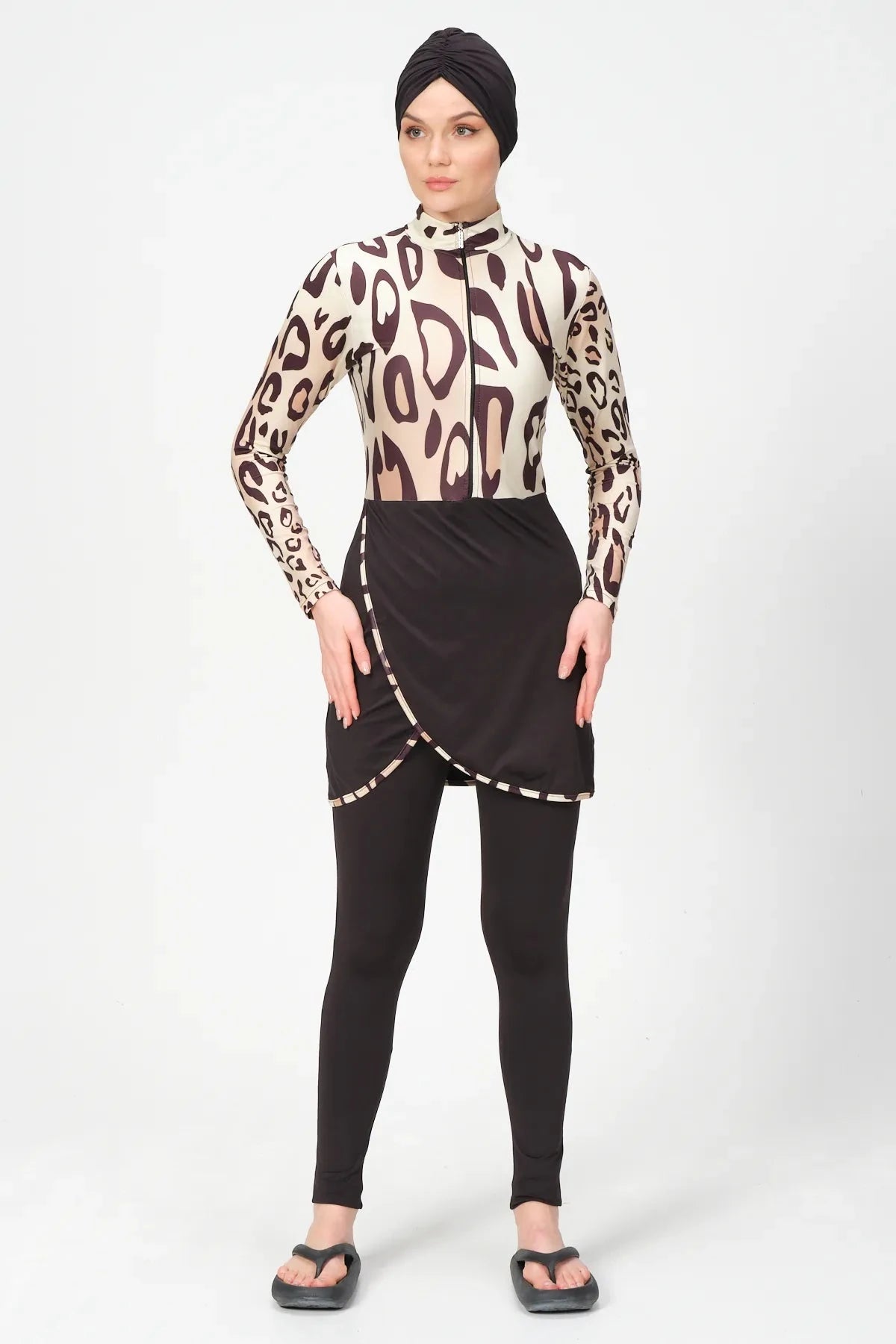 Modest leopard print burkini swimsuit with black turban and leggings.