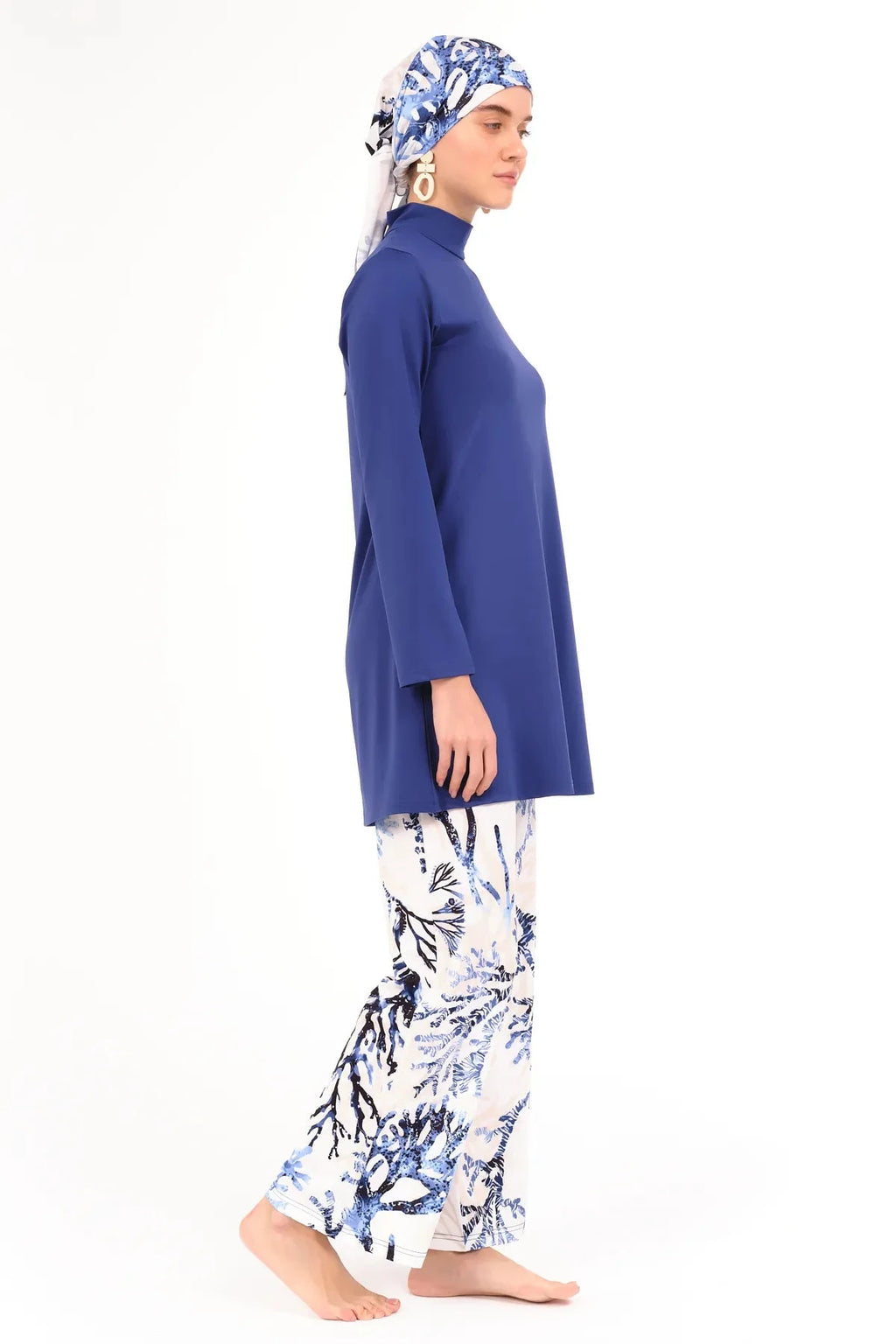 Side view of lycra printed burkini set with coral pattern.