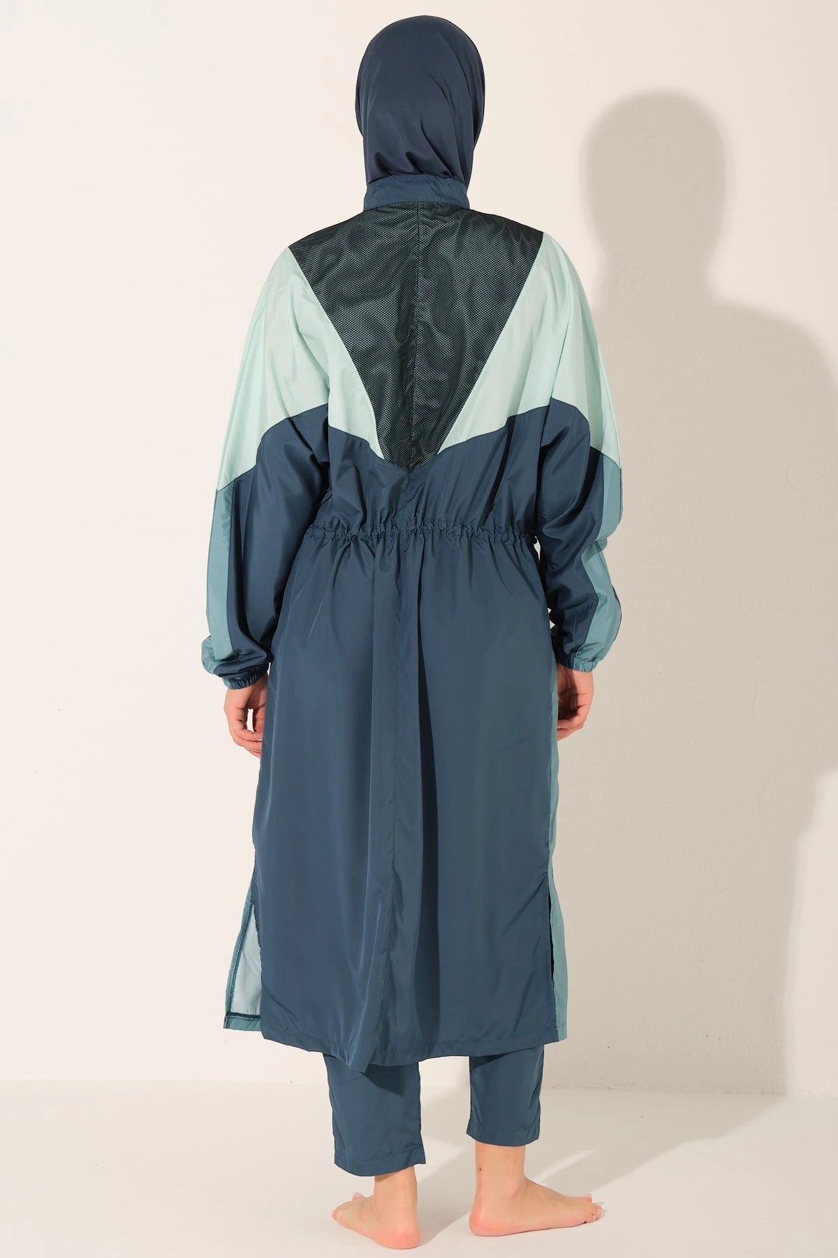 Back view of Petrol Pulse burkini with drawstring waist detail.