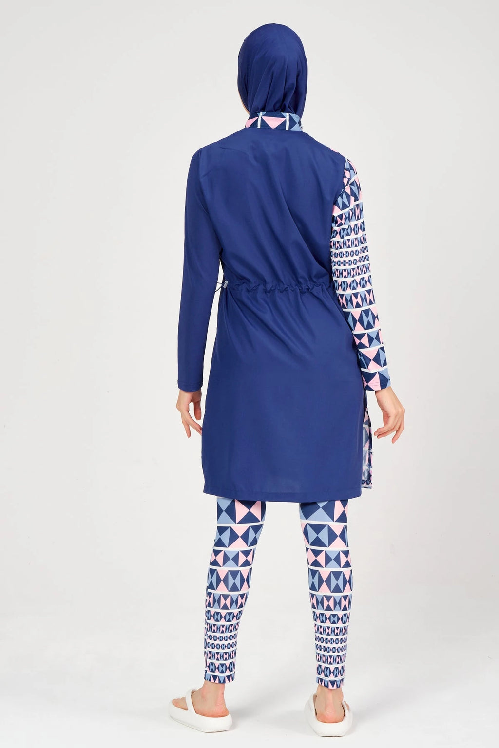 Model in blue burkini back view showing adjustable drawstring.