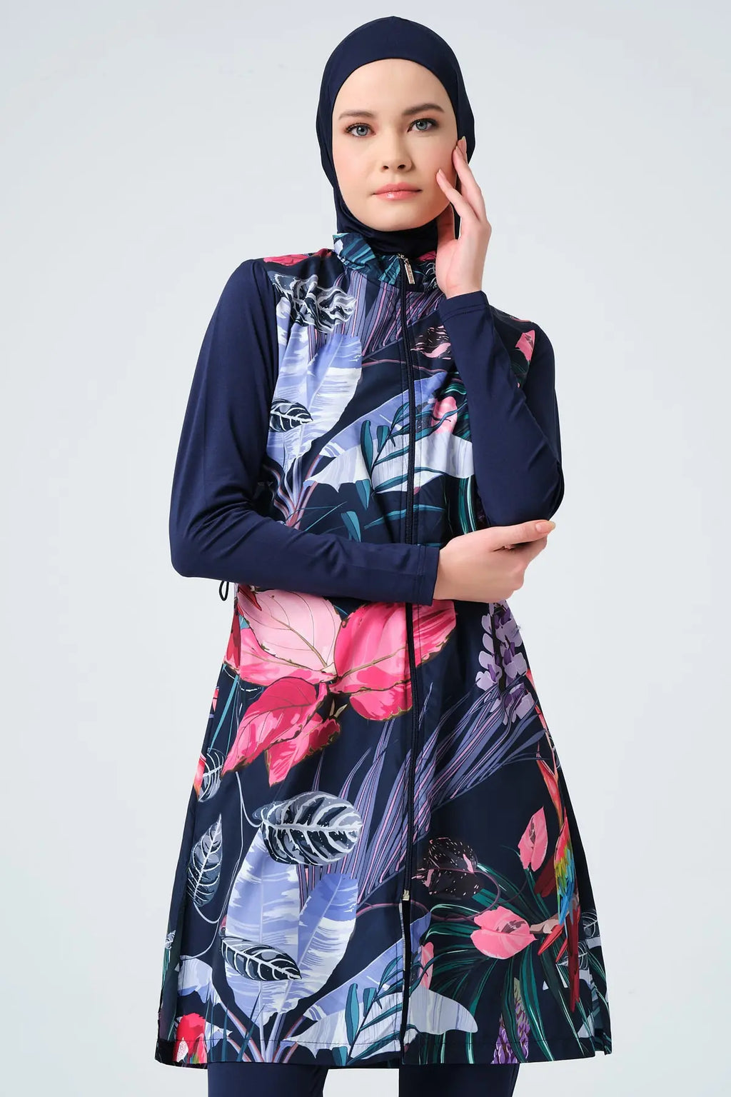 Close-up of navy blue burkini with tropical floral print and front zipper