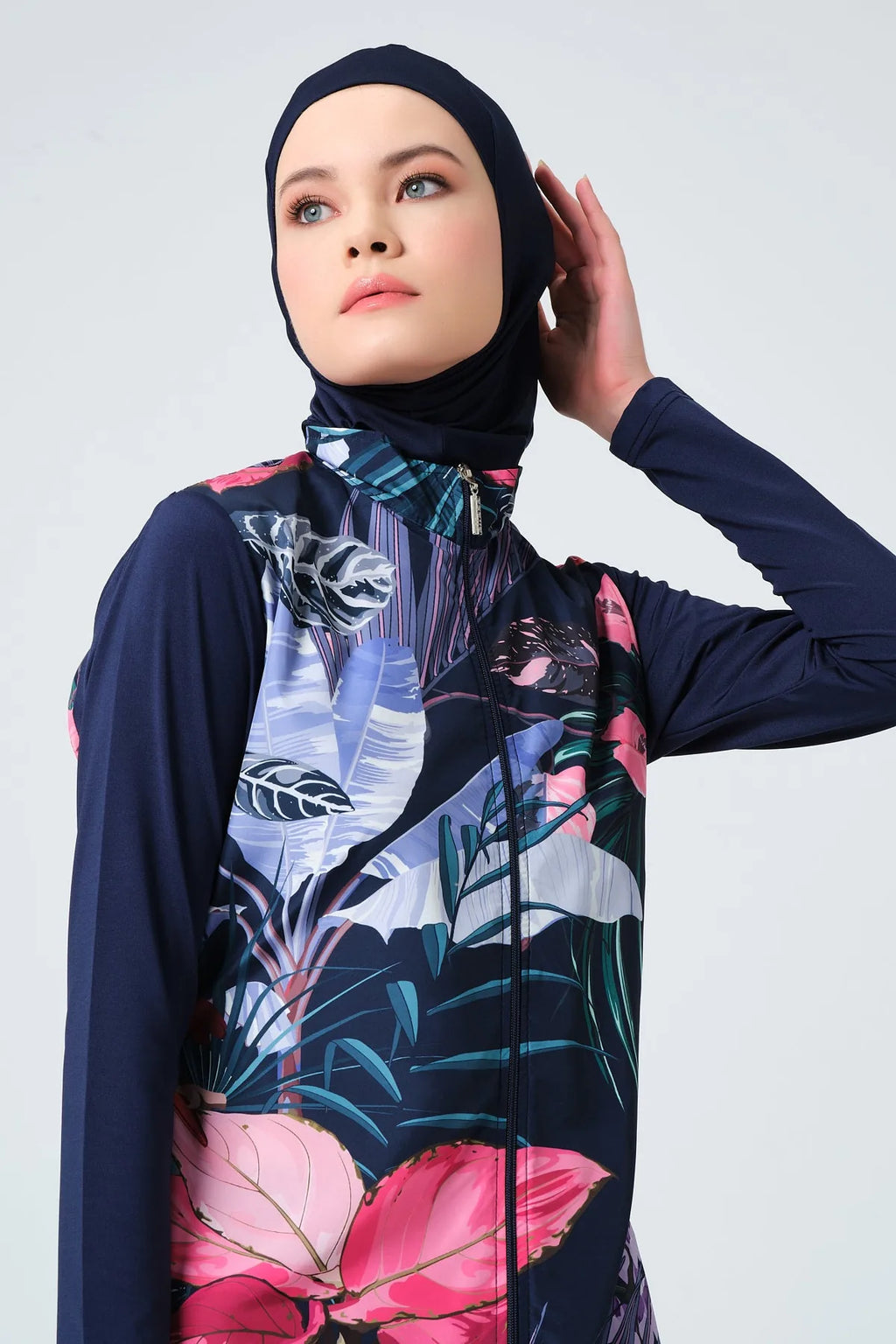 Close-up of navy blue burkini collar and zipper with tropical print