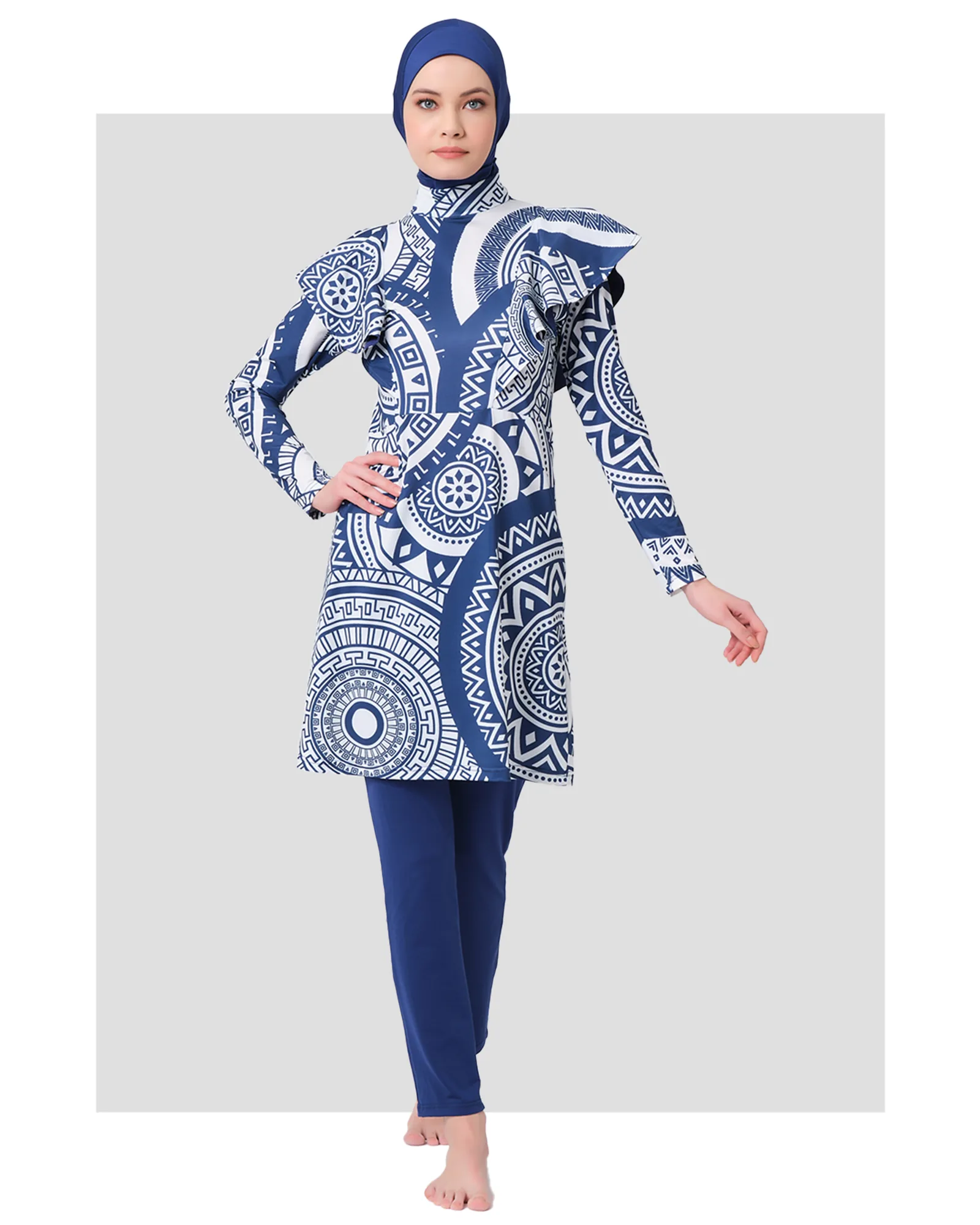 Model in blue and white geometric print burkini front view.