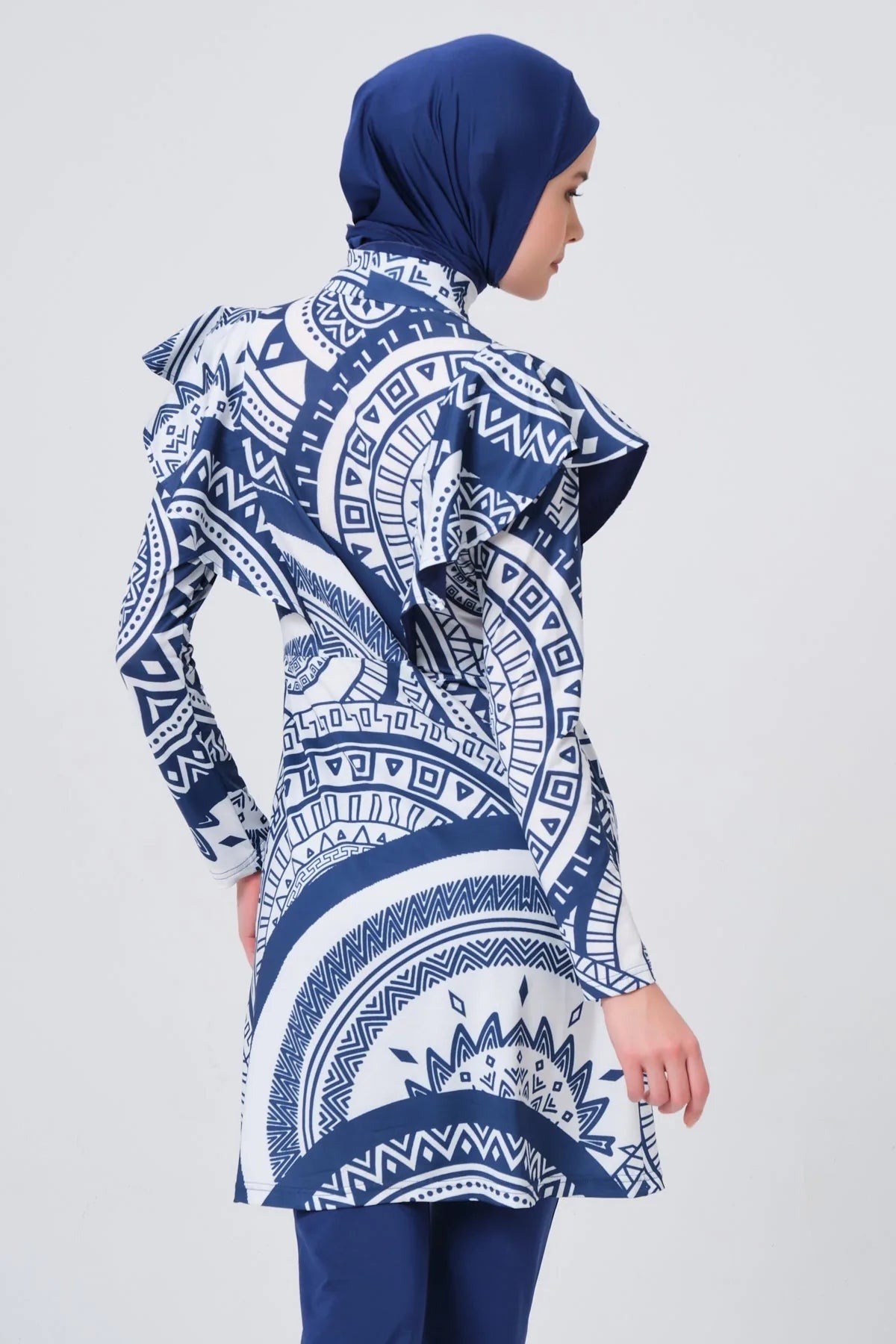 Blue and white geometric print burkini side view showing shoulder detail.