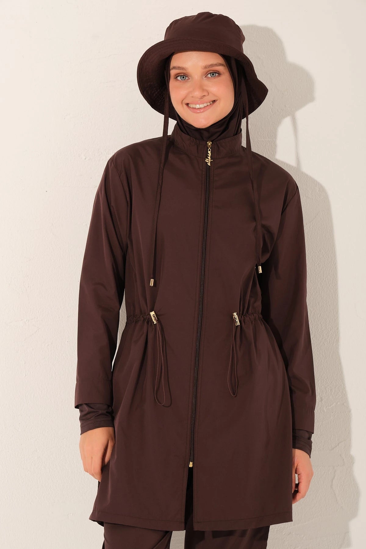 Close-up of mocha burkini top with full zipper and matching hat.