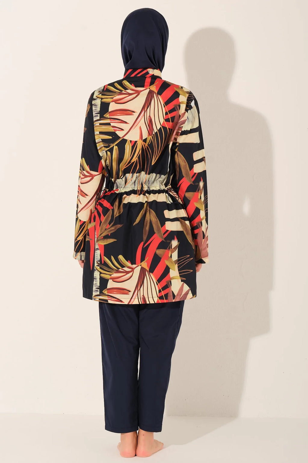 Back view of tropical print burkini set showing adjustable drawstring detail.