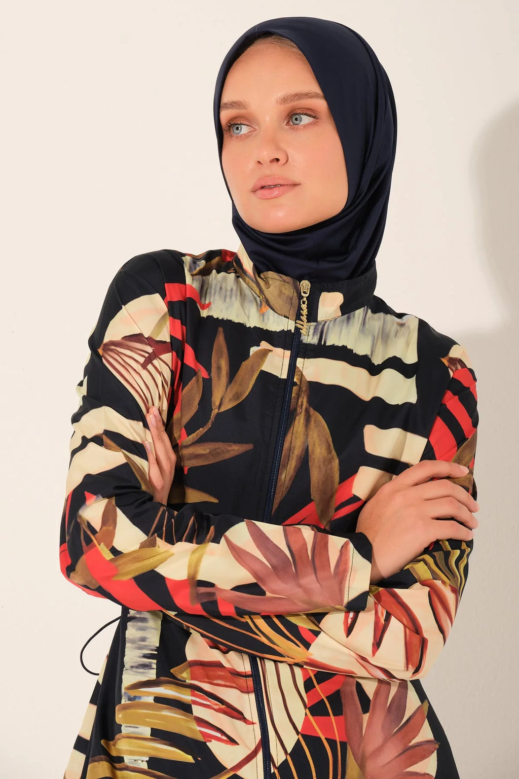 Close-up of tropical print burkini top and matching dark hijab.