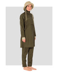 Woman in olive trail burkini and beige hat, front view.