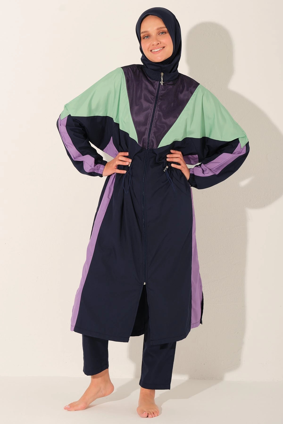 Aurora Pulse multi-color burkini set front view with model posing.