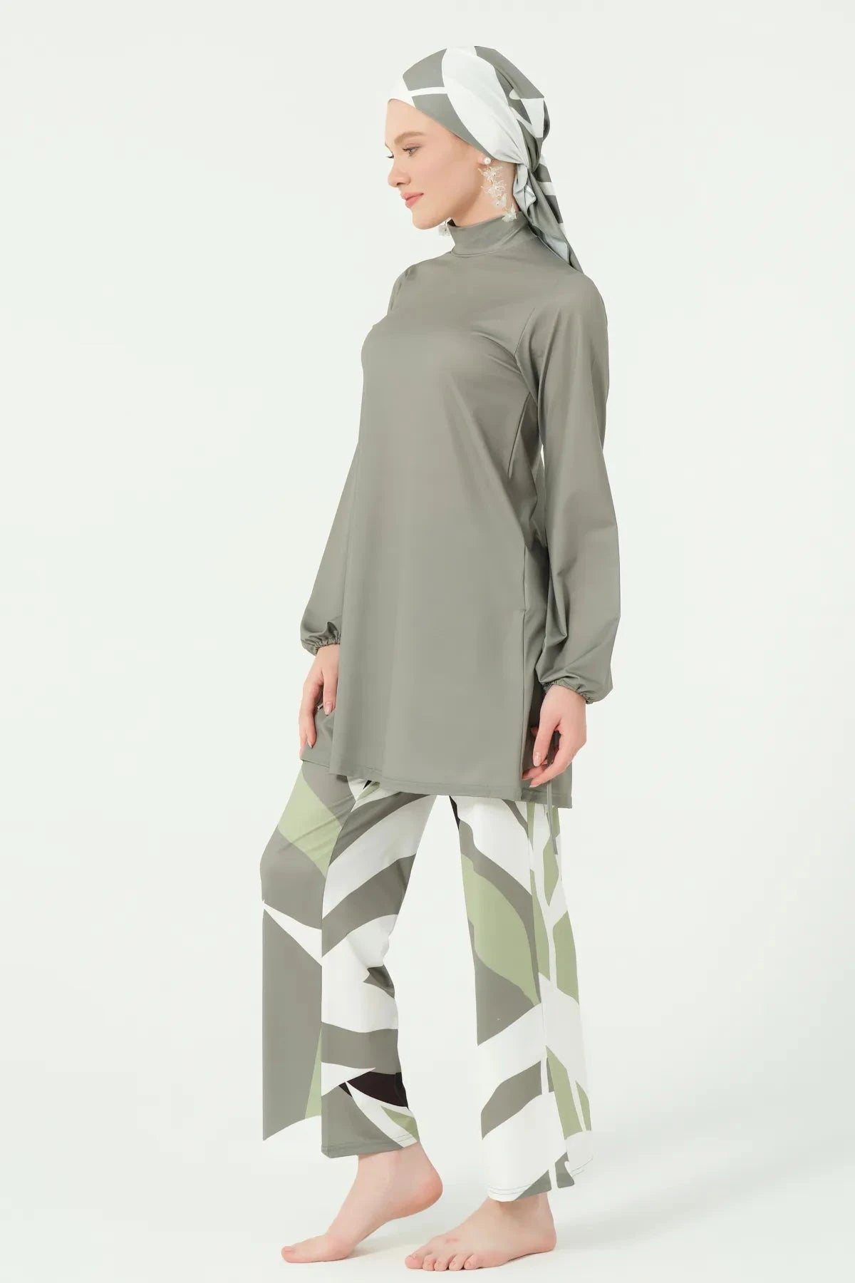 Side view of modest olive green burkini with geometric print.