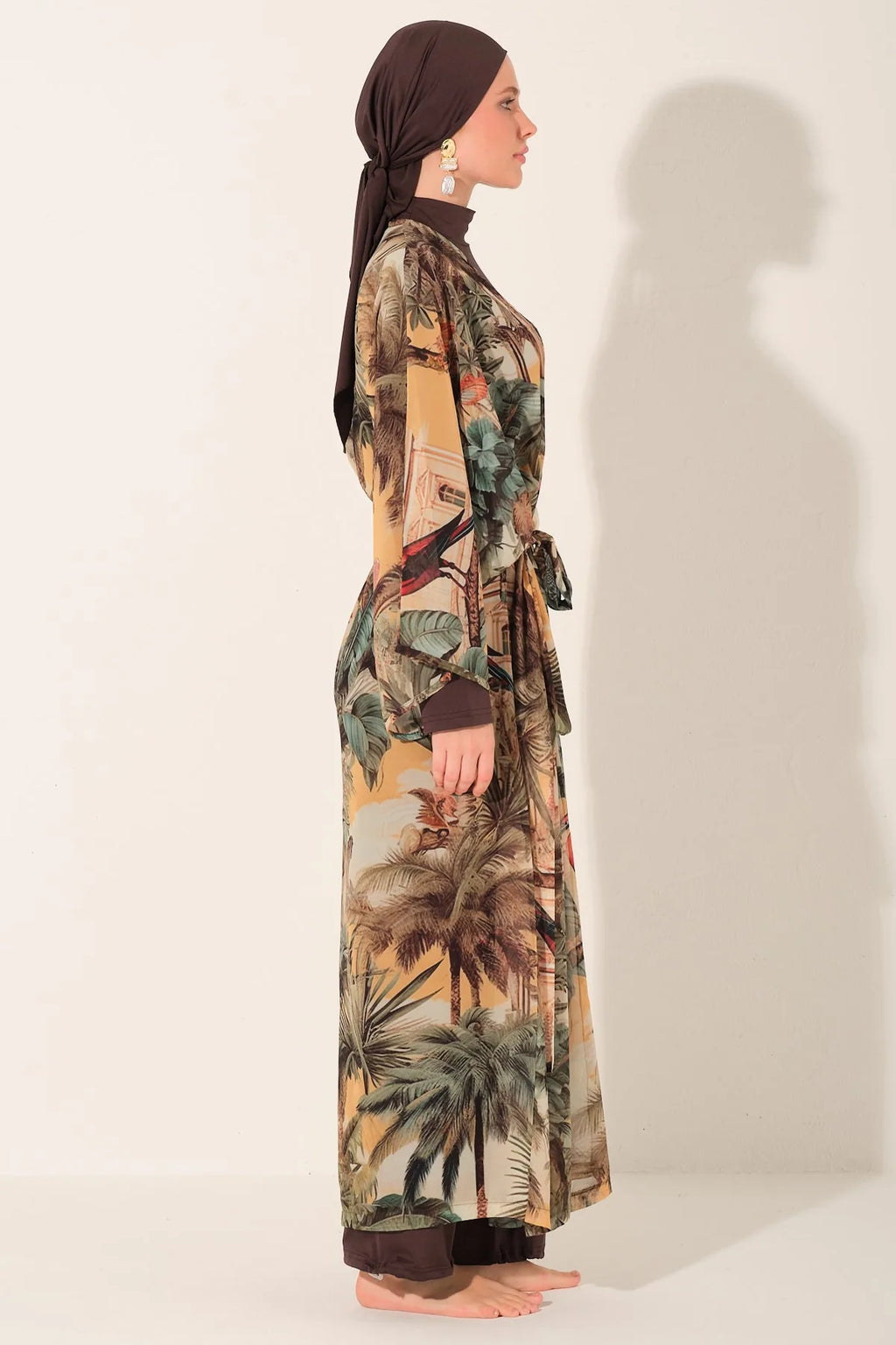 Mocha burkini with tropical print kimono, side view on model.