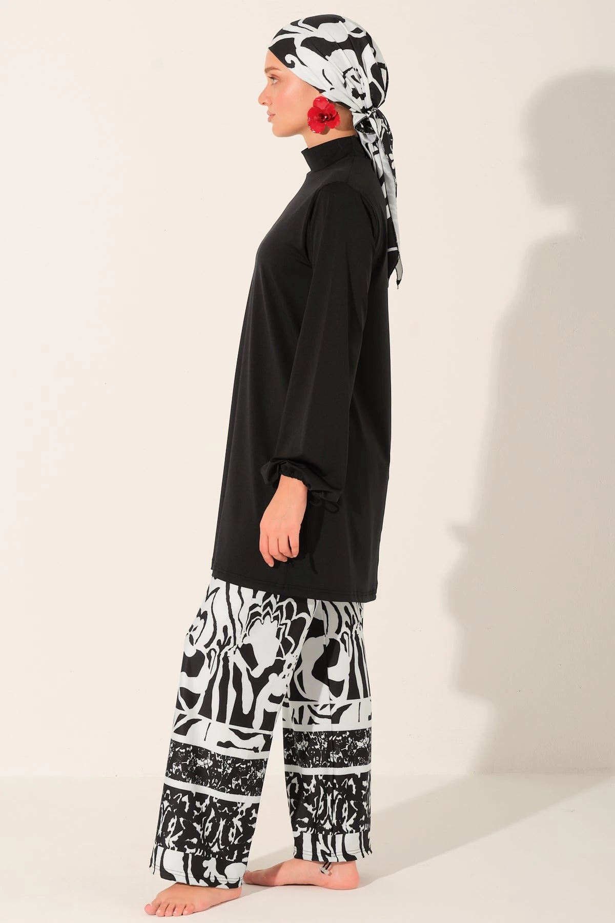 Black and white burkini set side profile on a white background.