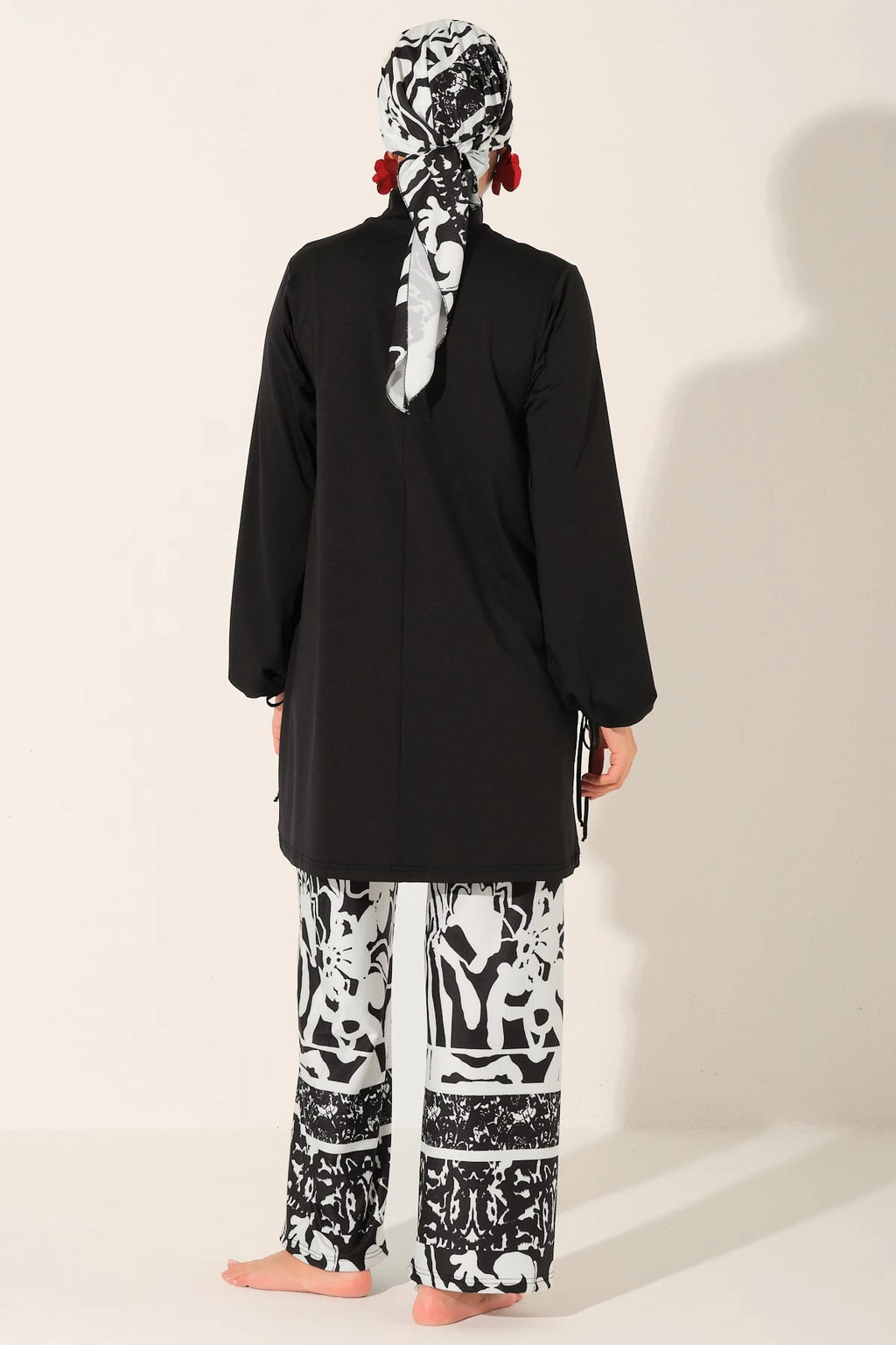 Black and white burkini set back view on a white background.